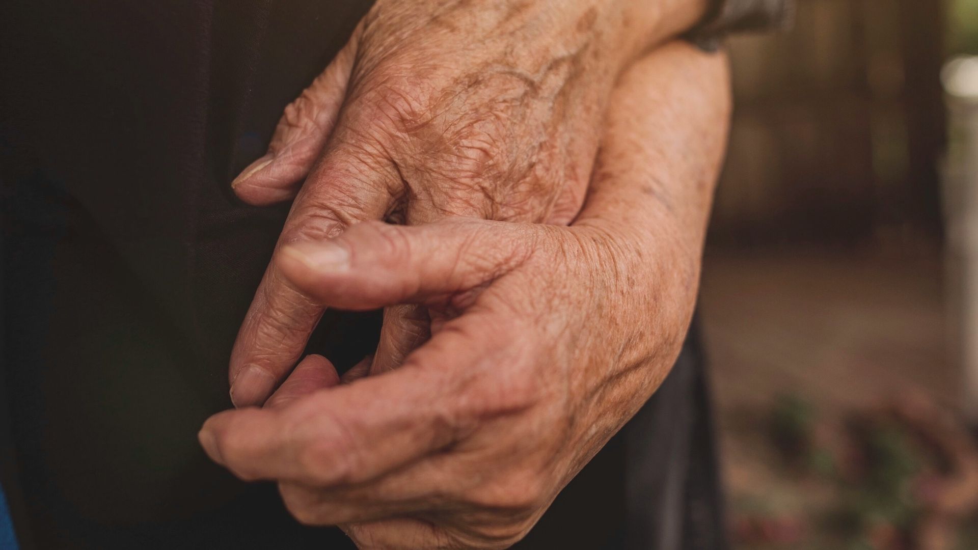 person in white long sleeve shirt and black pants