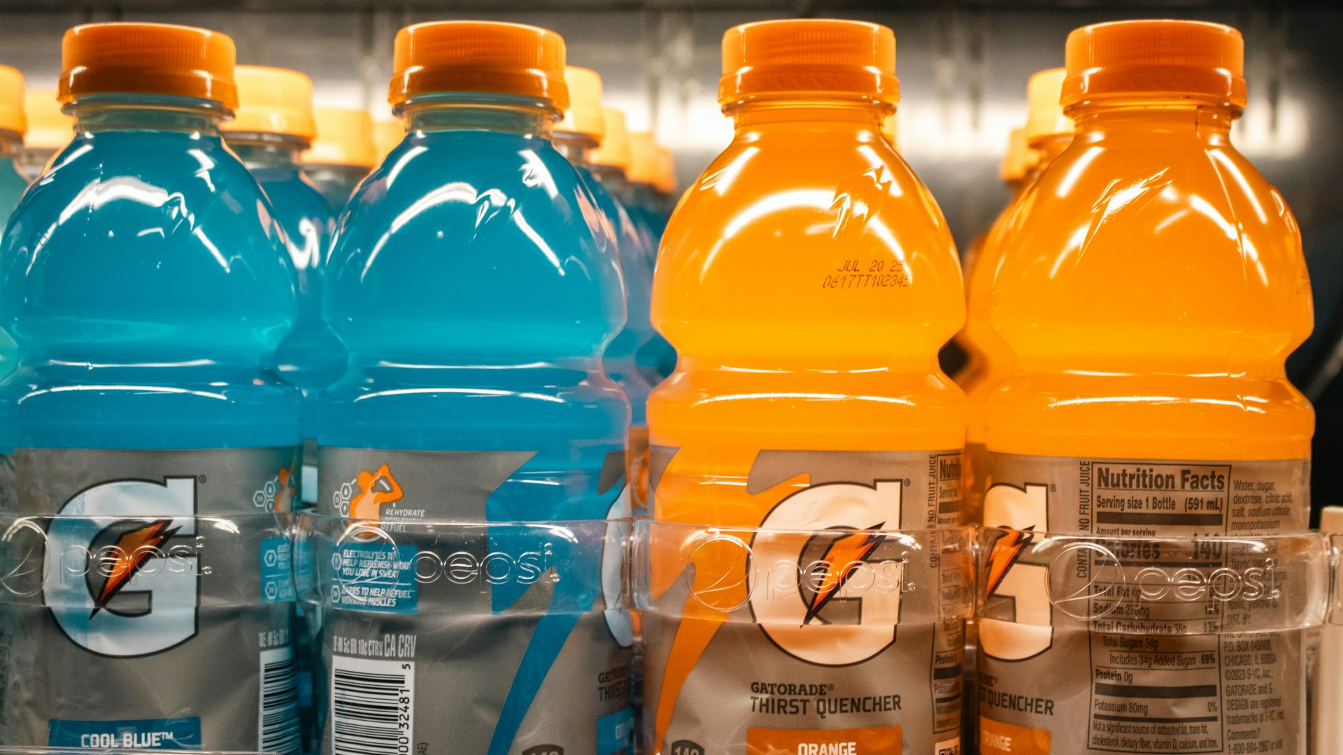 Gatorade bottles are shown on a shelf.