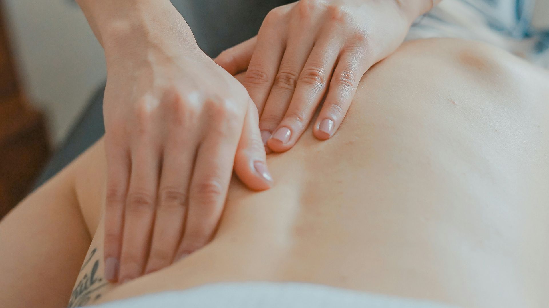 man massaging woman's body