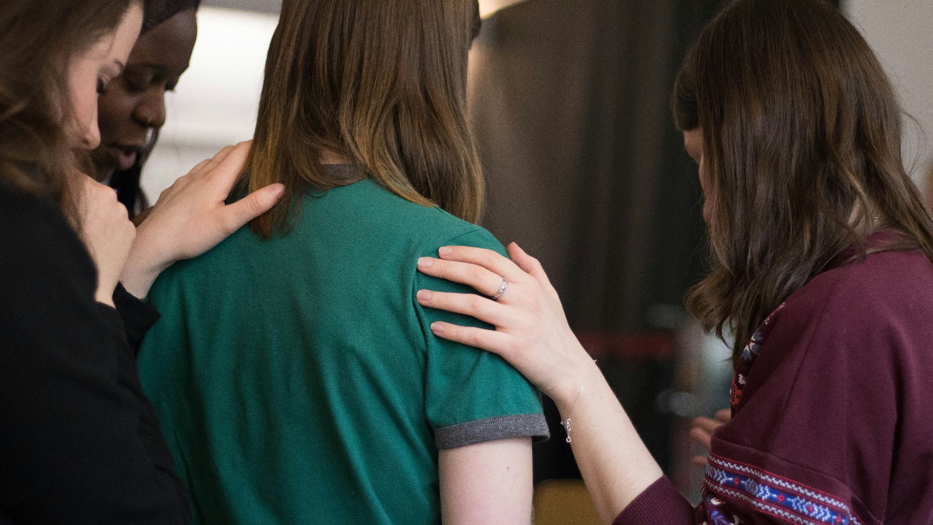 four women looking down