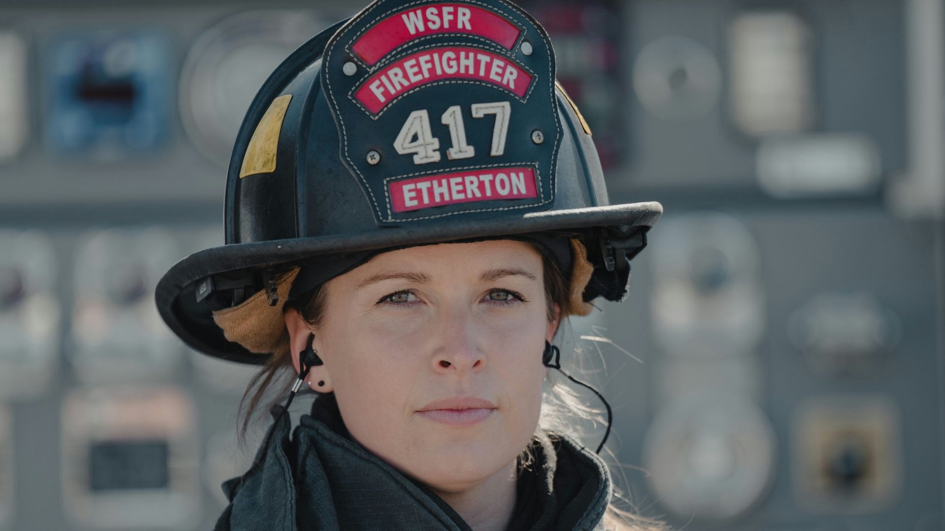boy in black leather jacket wearing black and red helmet