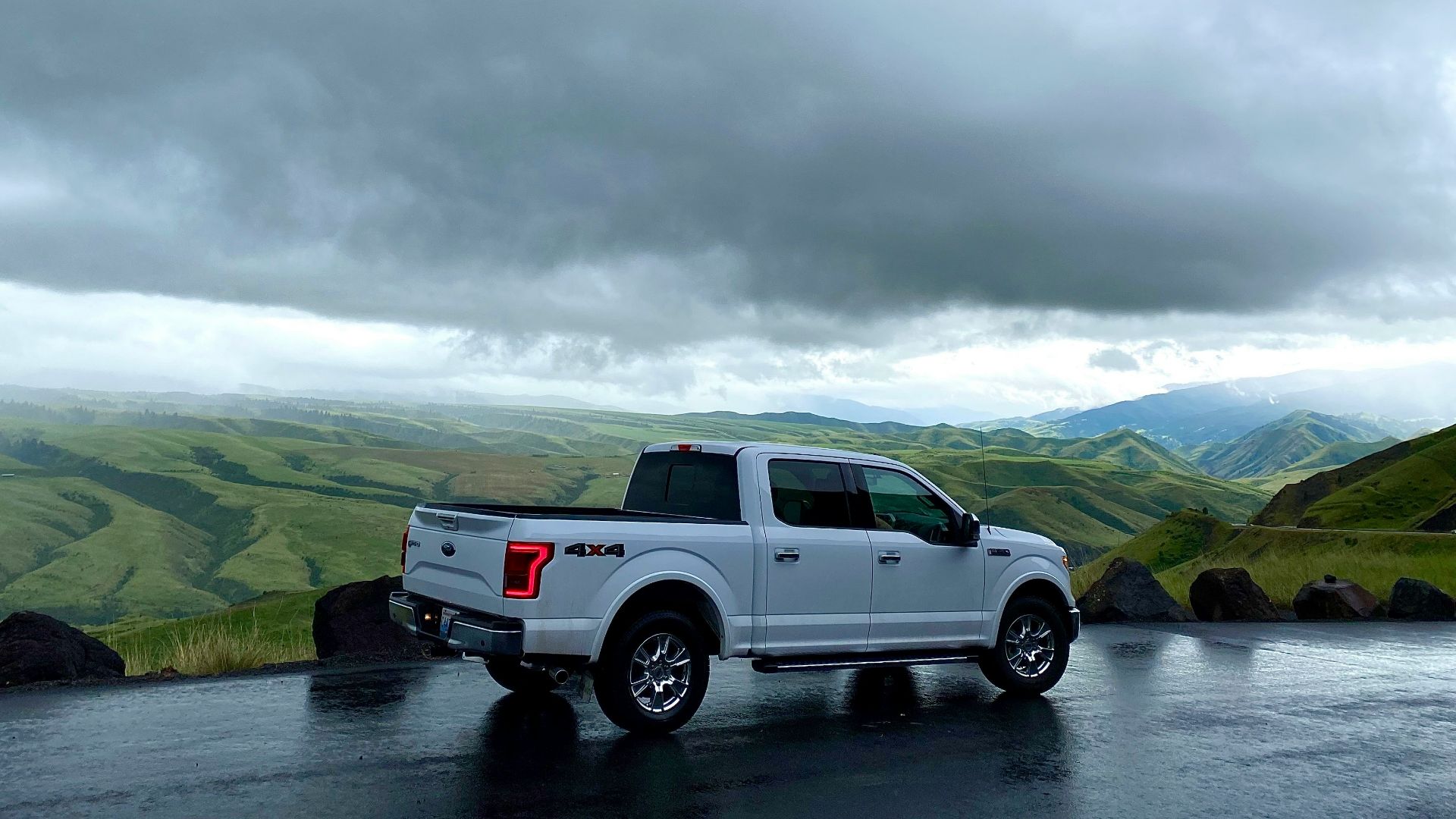 white crew cab pickup truck on river during daytime