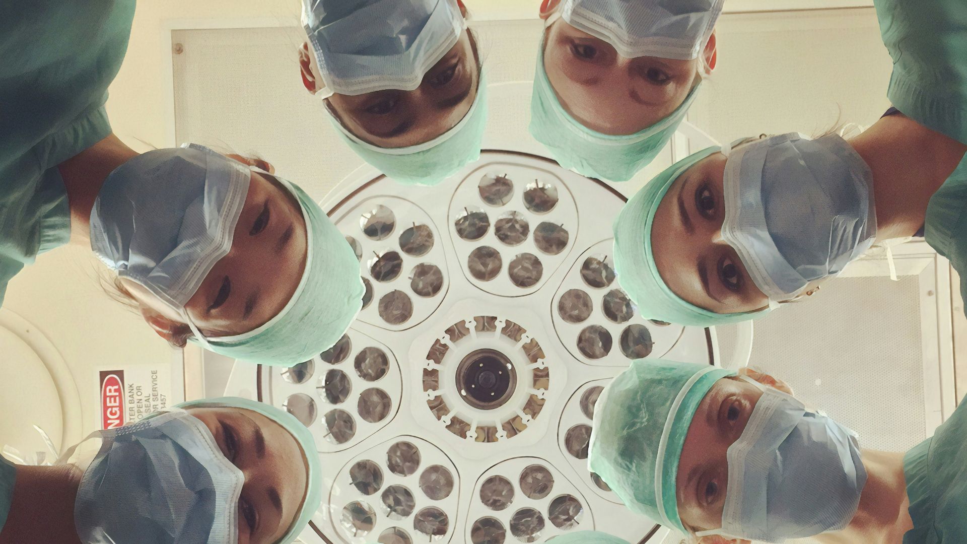 people in white shirt holding clear drinking glasses