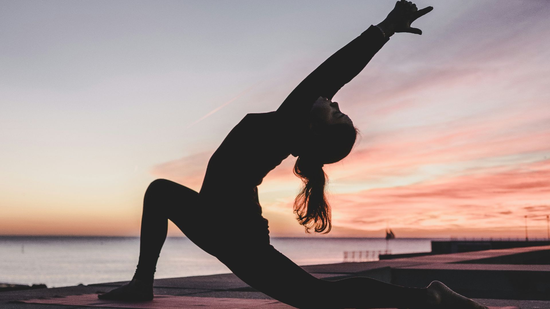 silhouette photography of woman doing yoga
