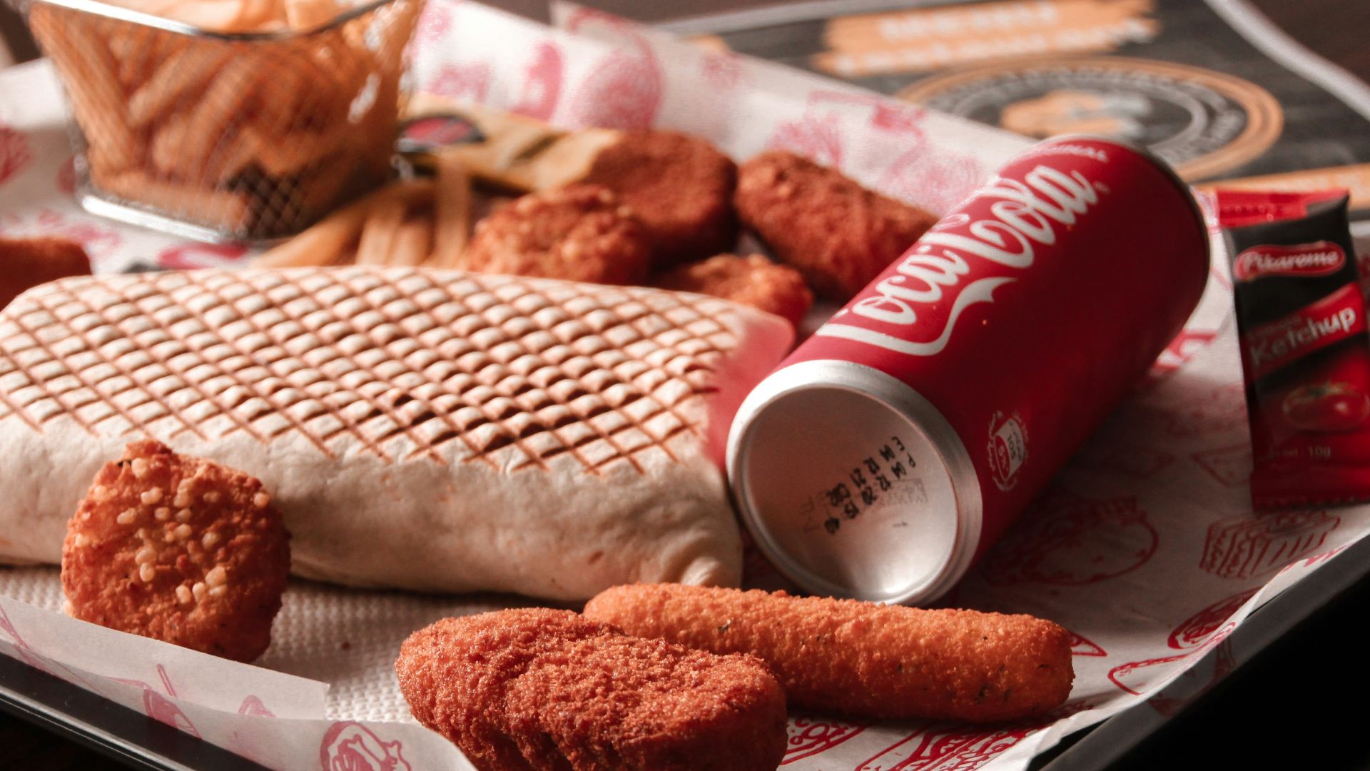 red and white coca cola can beside brown bread on white ceramic plate