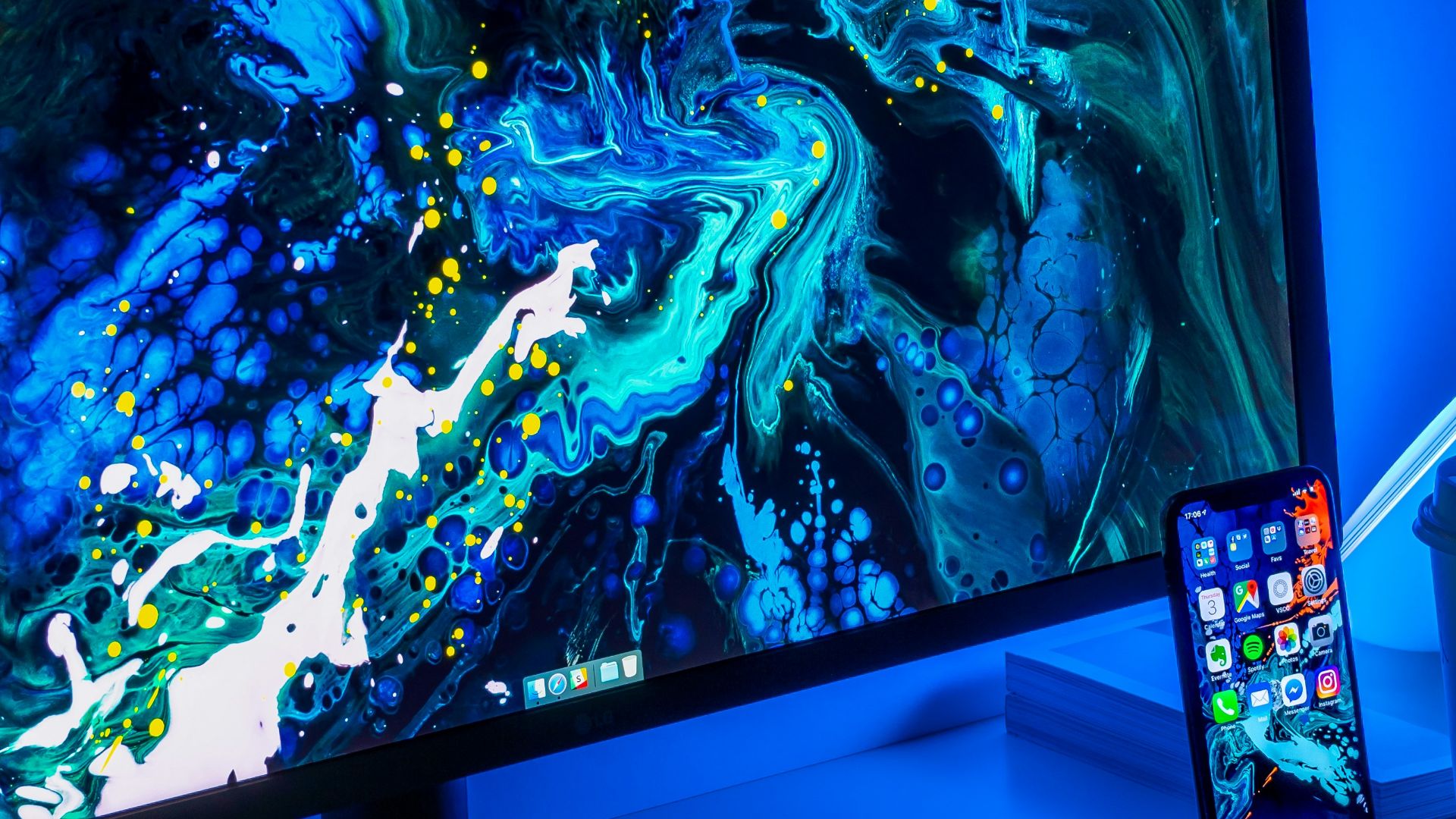 flat screen computer monitor turned on beside black keyboard