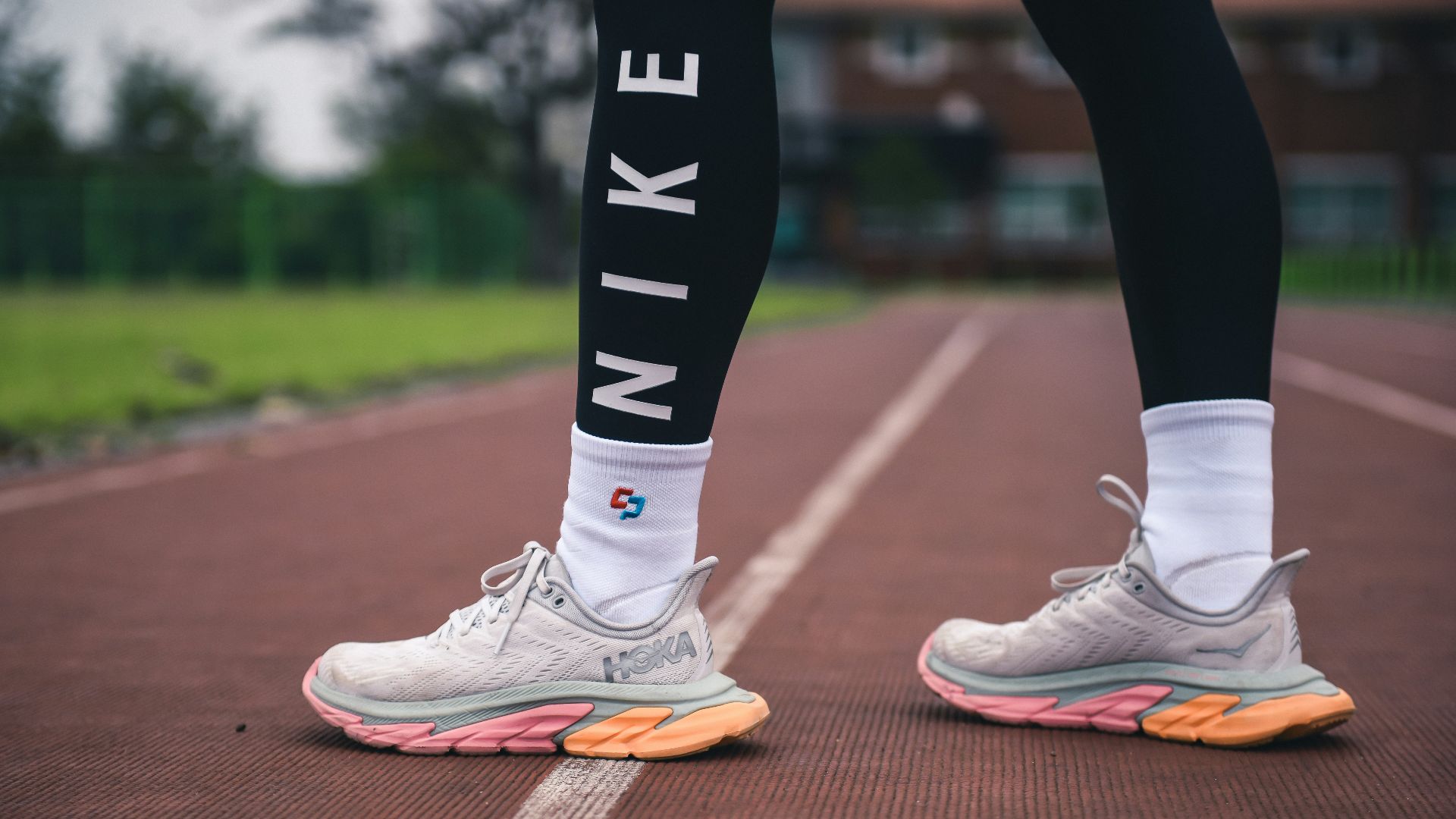 person in white nike athletic shoes