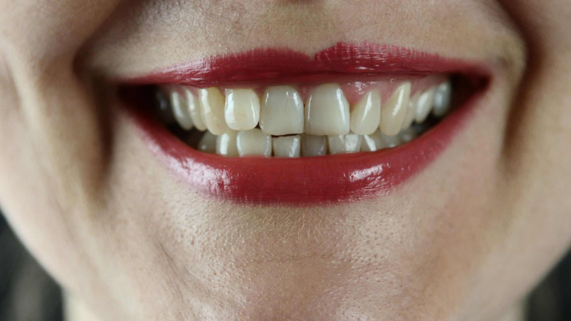 person with red lipstick and red lipstick