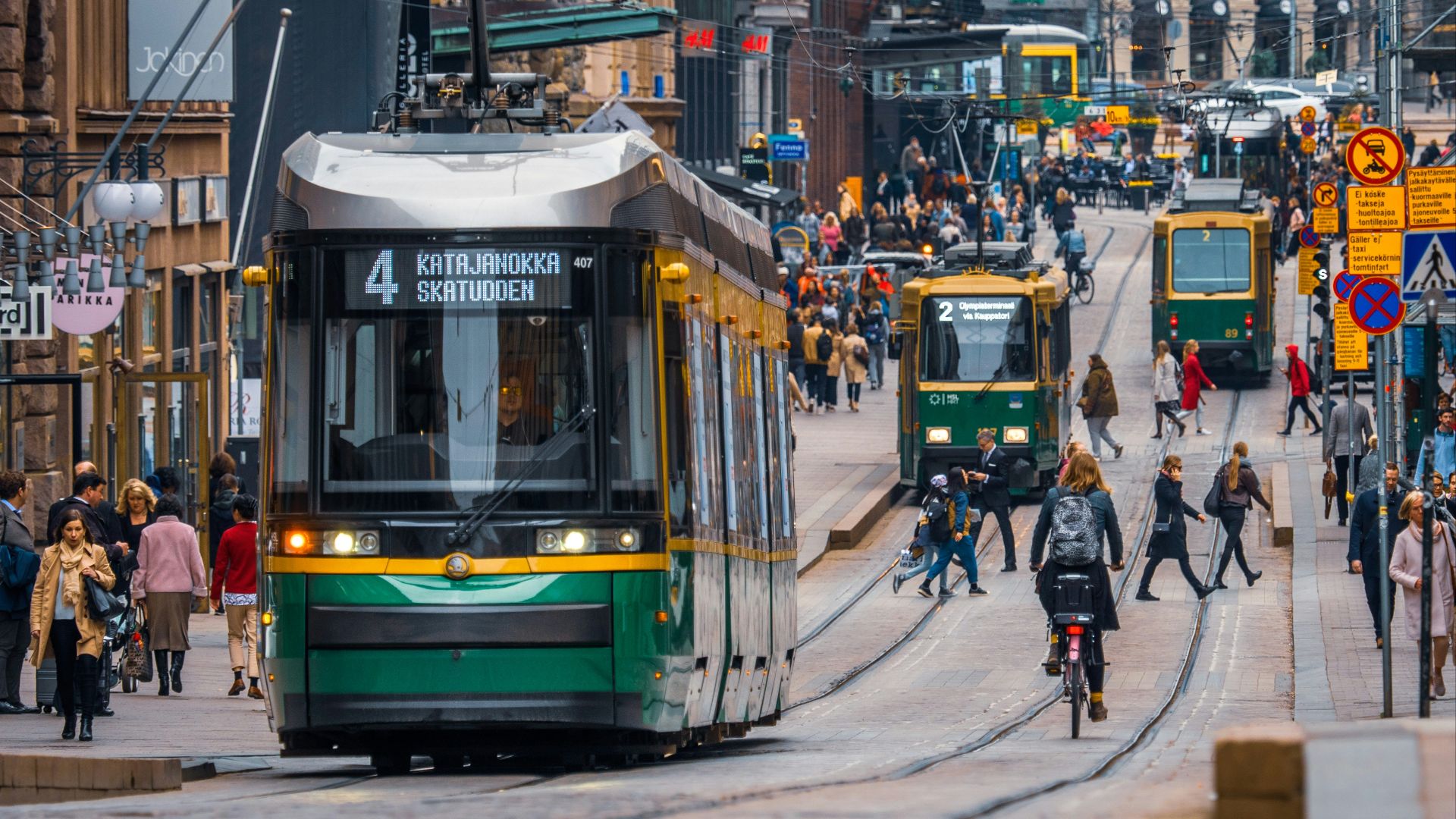 green and yellow city tram