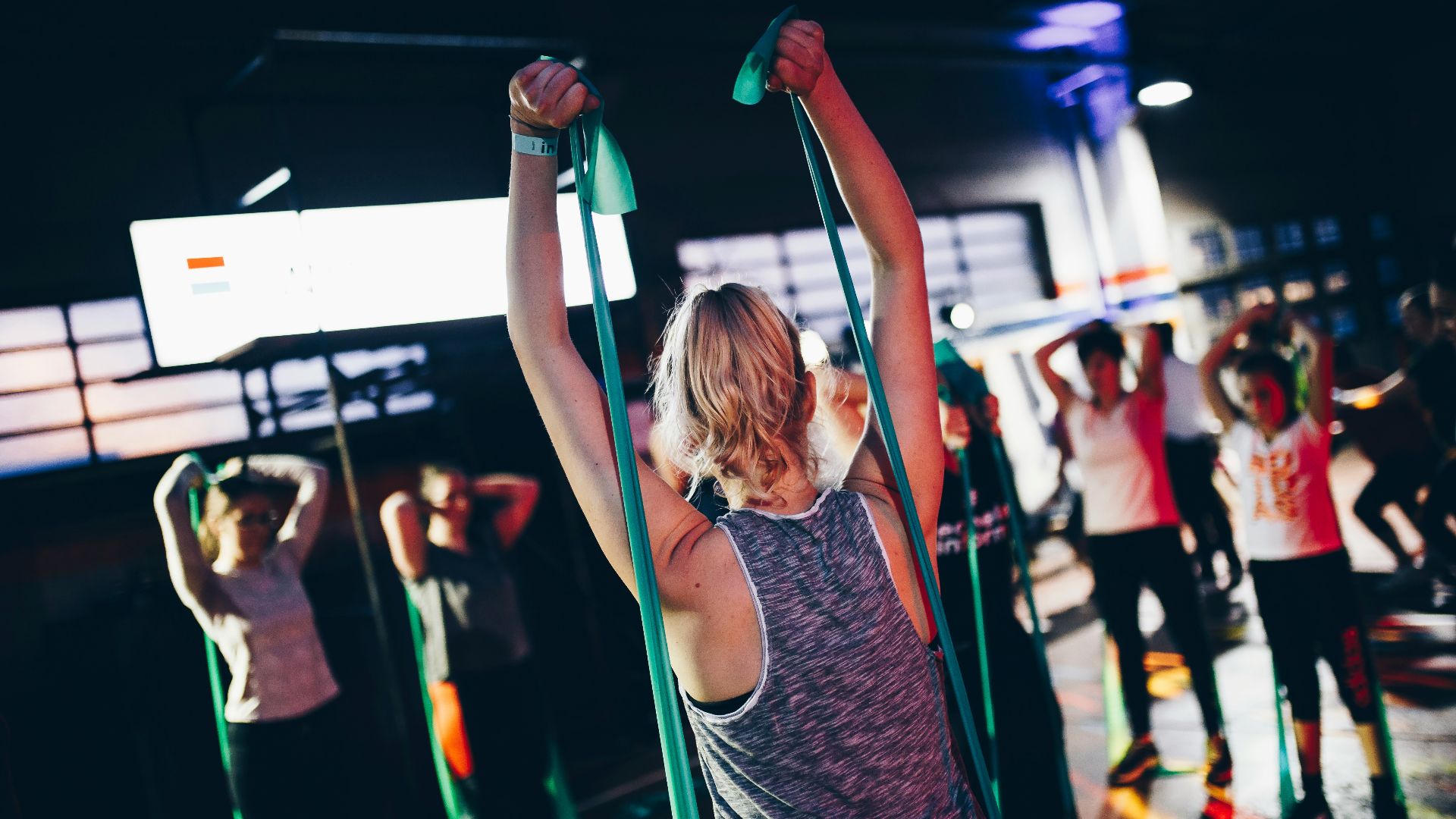 group of people in gym while exercising