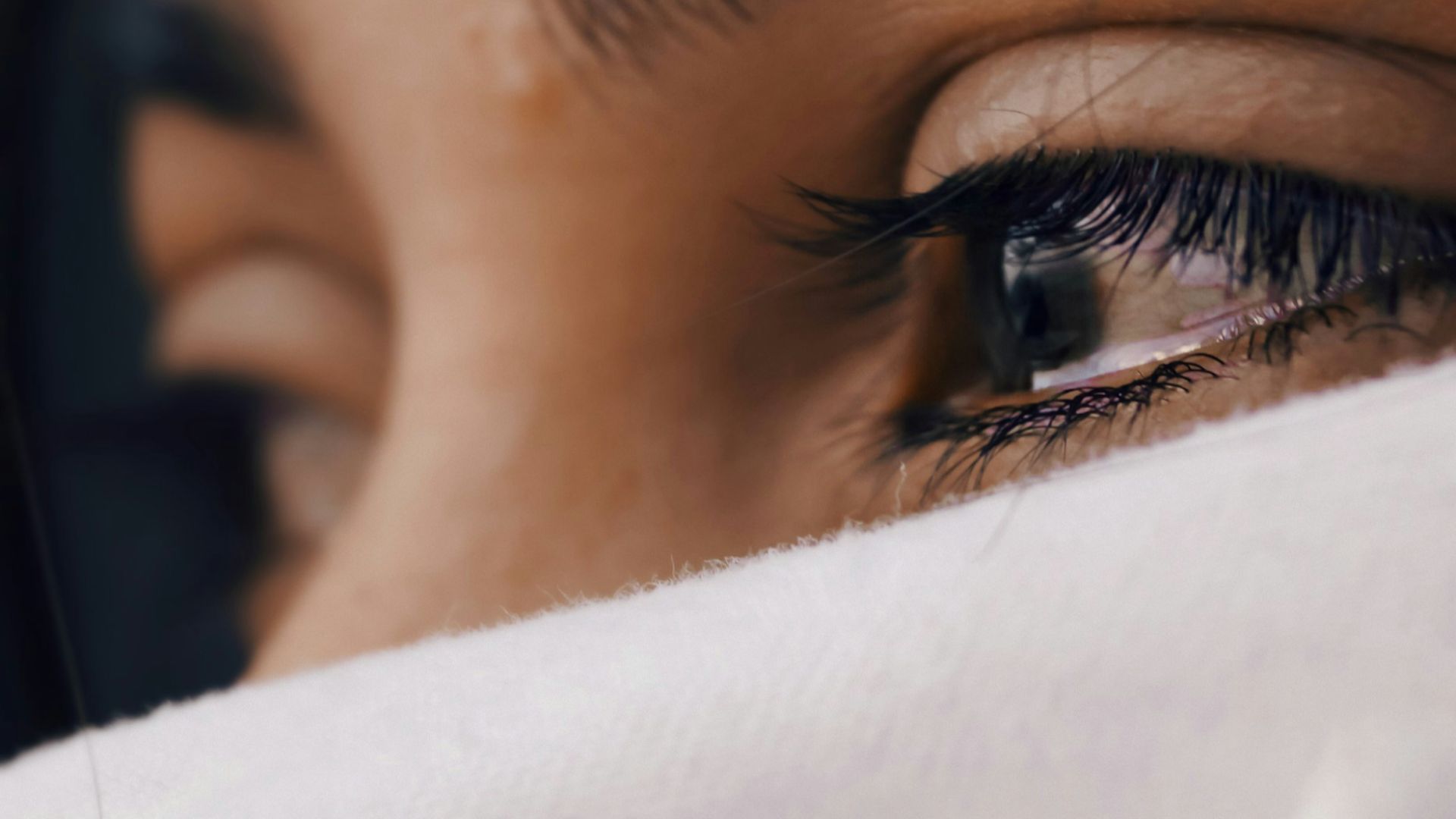 shallow focus of a woman's sad eyes