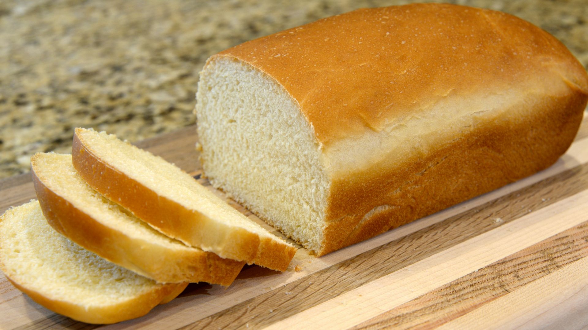 bread on brown wooden chopping board