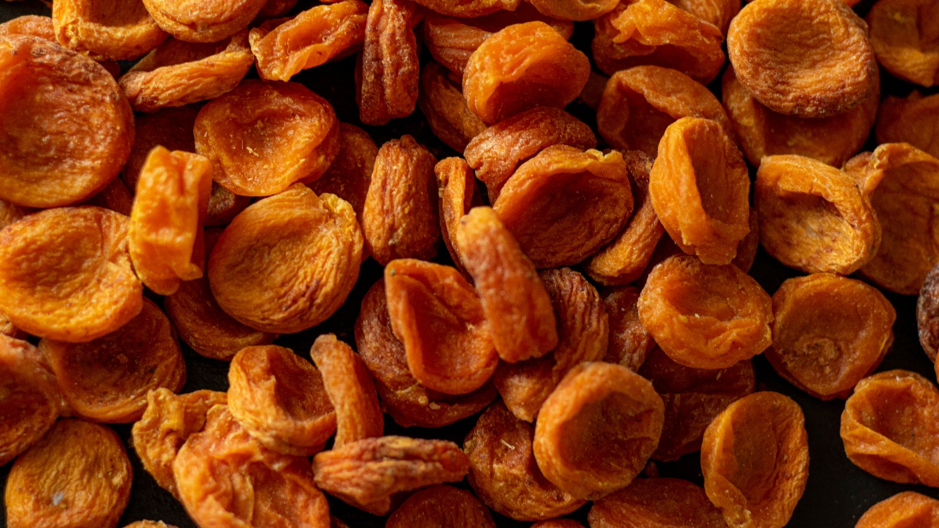 brown almond nuts on brown wooden surface