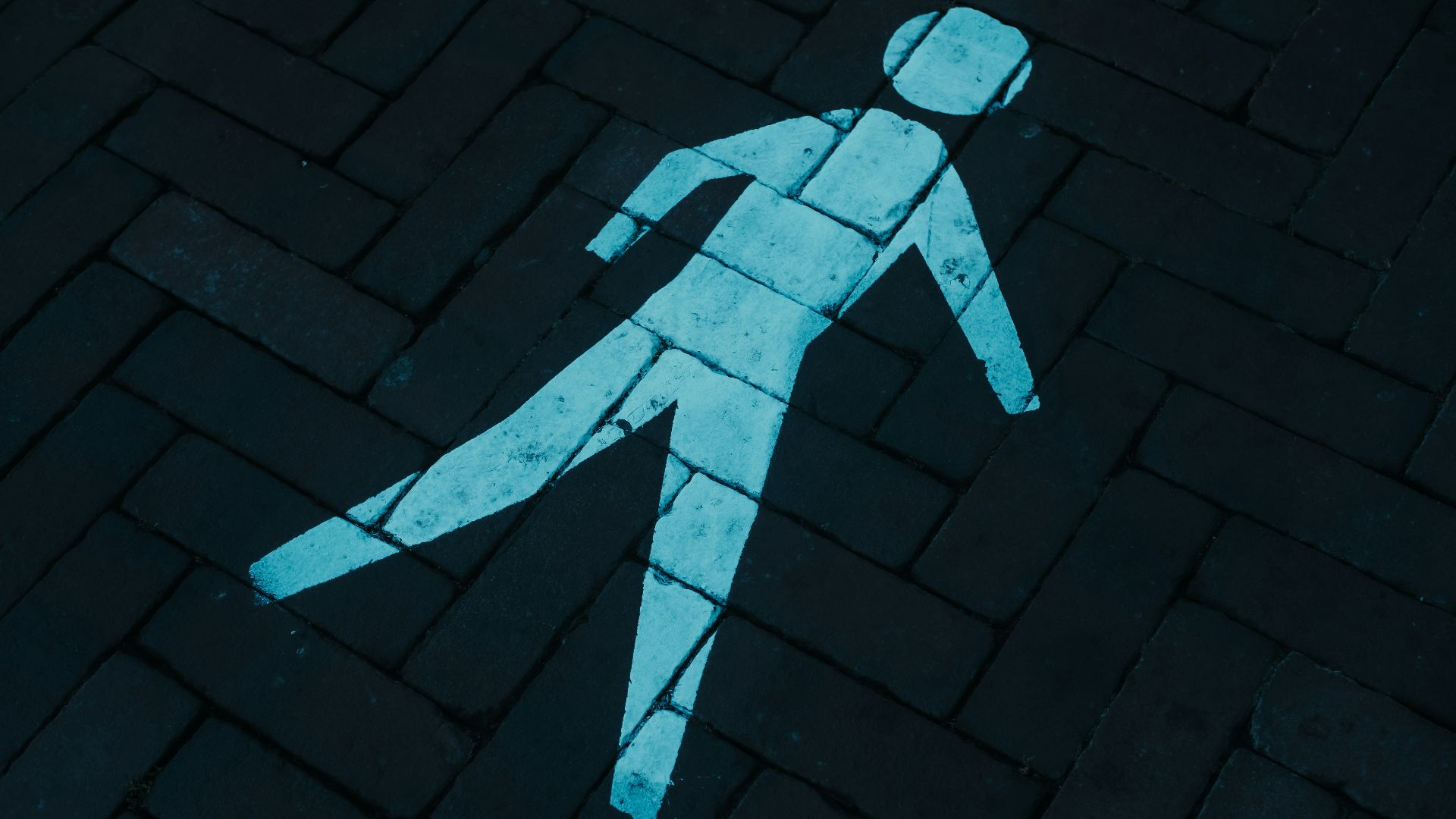 a cobblestone road with a stone circle in the middle