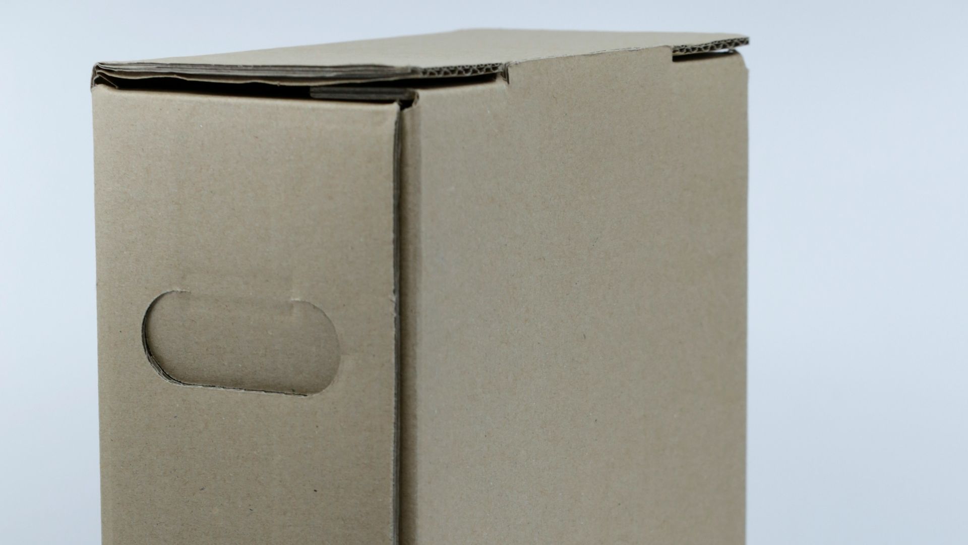 gray cardboard box on white table