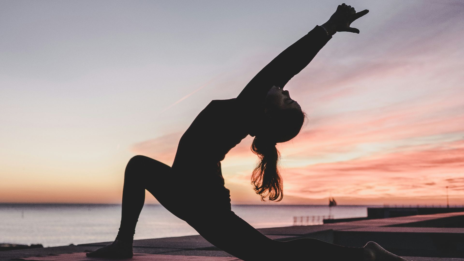 silhouette photography of woman doing yoga