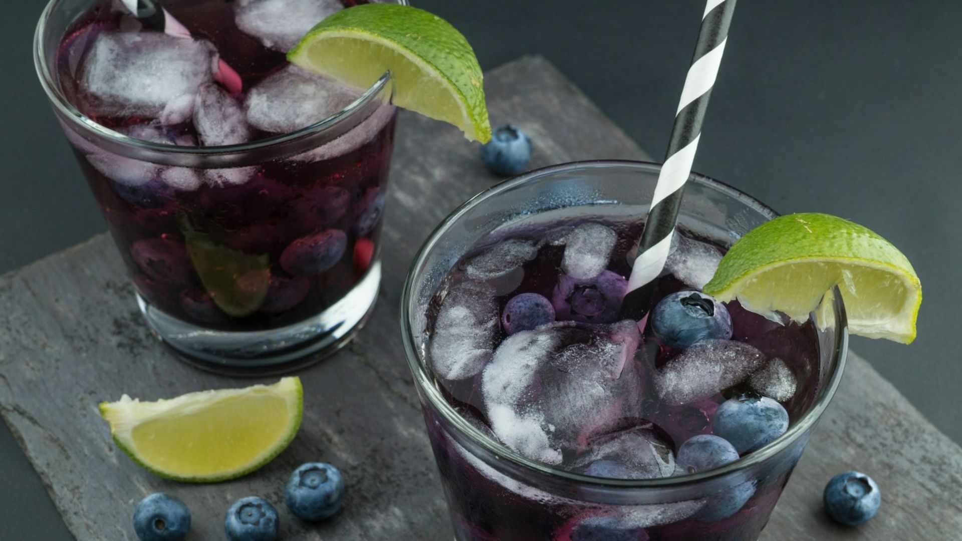 rock glasses surrounded by blackberries
