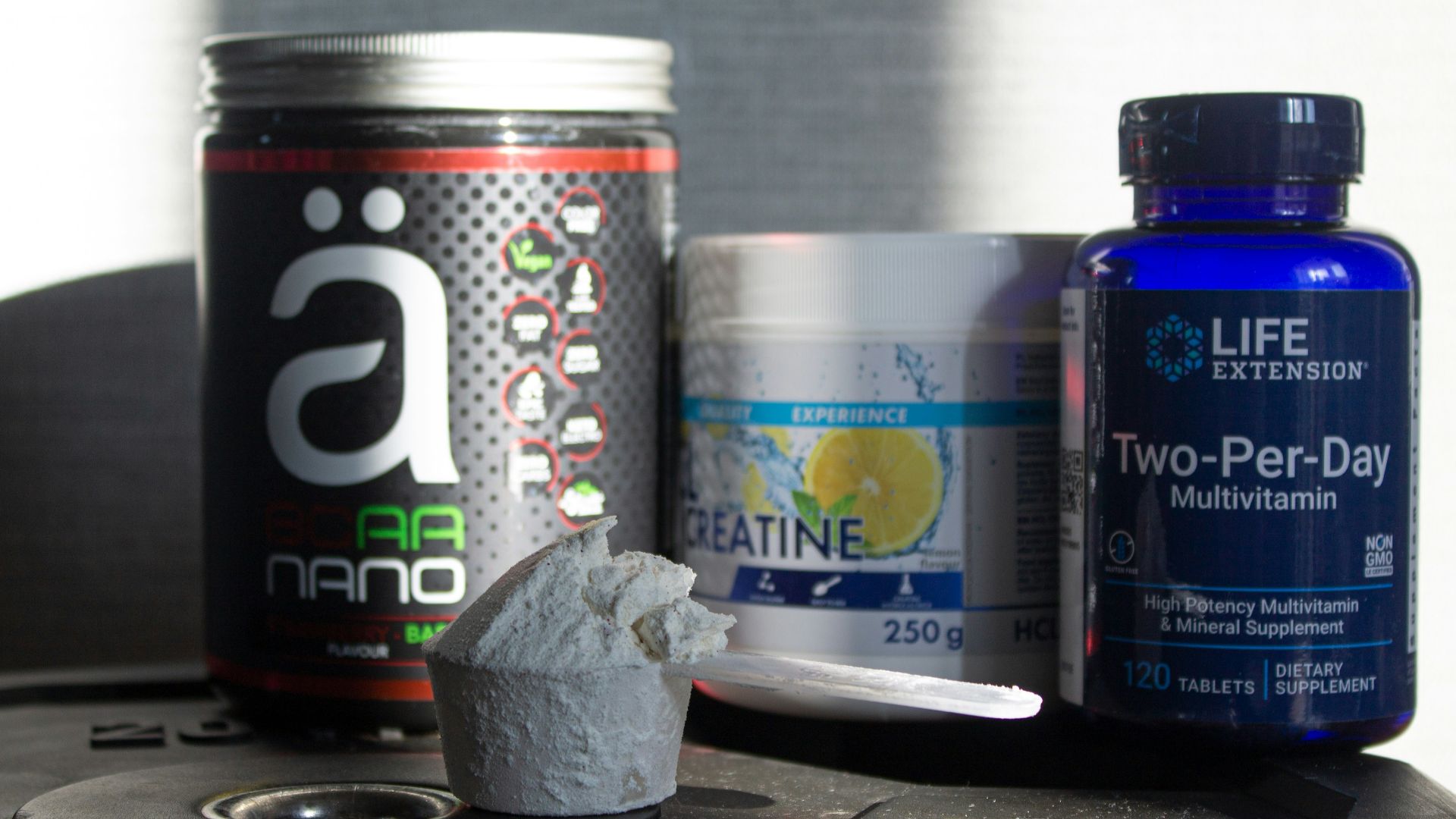 a table topped with bottles of vitamins and pills