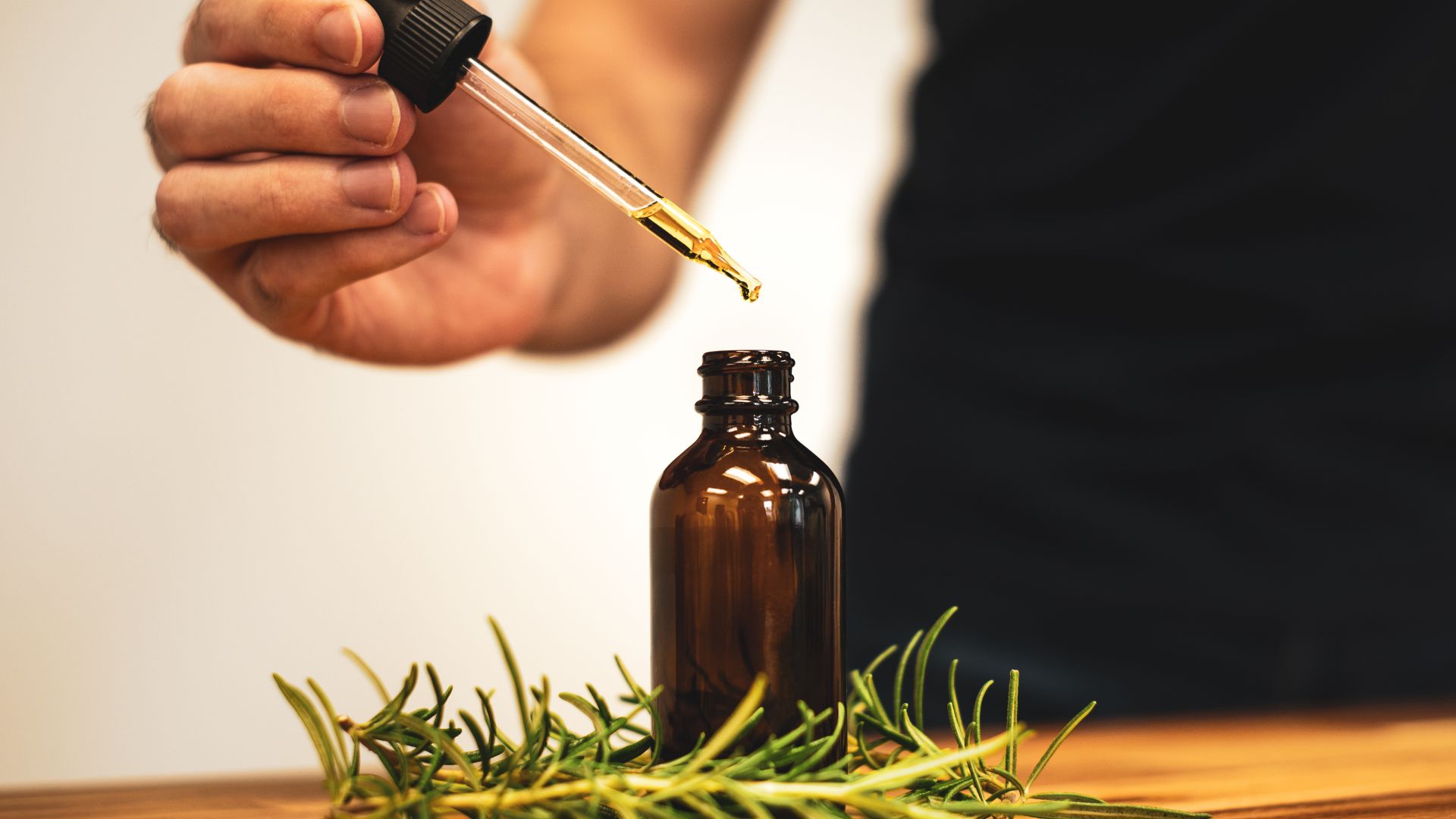 File:Taking rosemary oil from a bottle.jpg