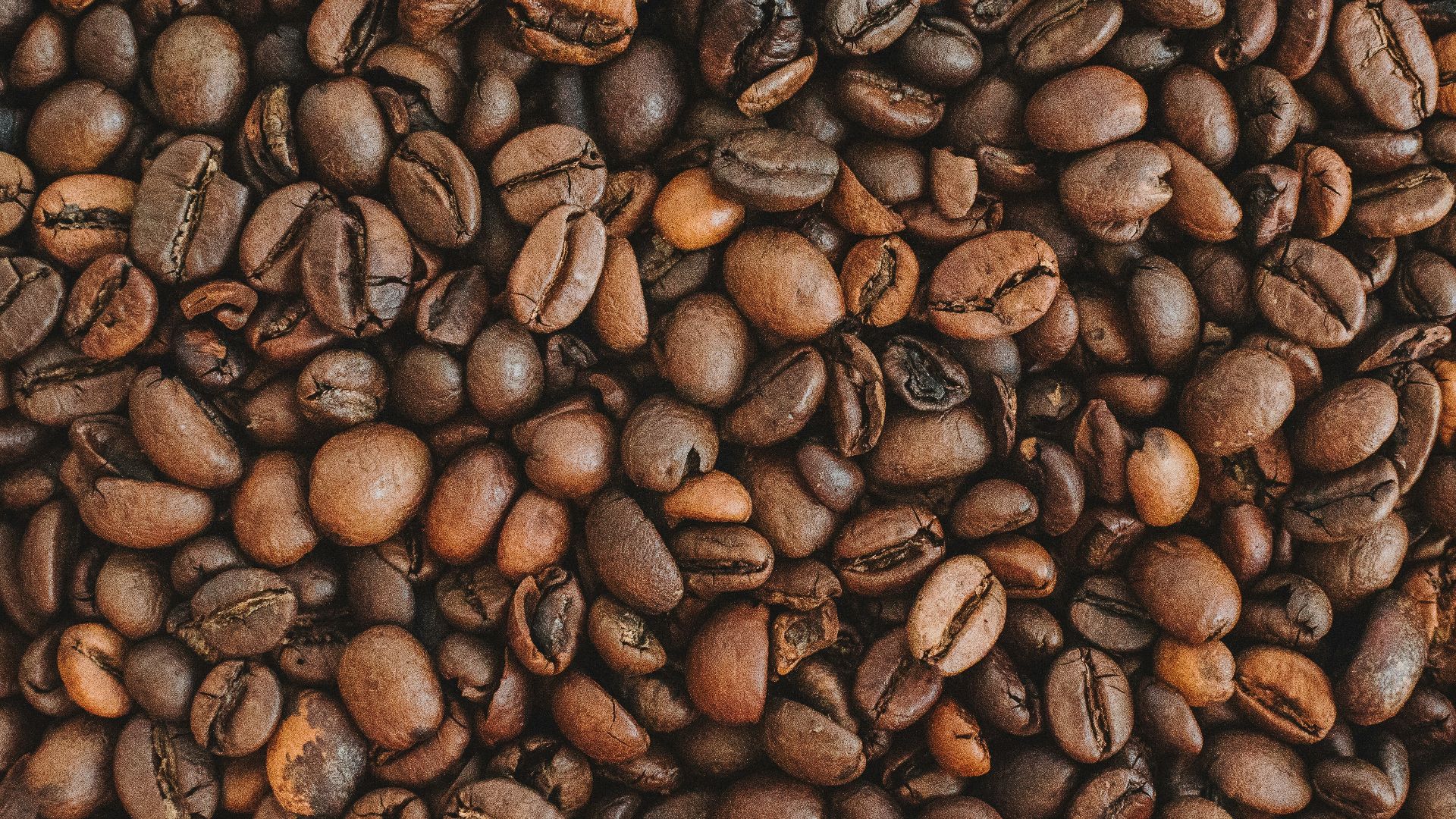 brown coffee beans on brown wooden table