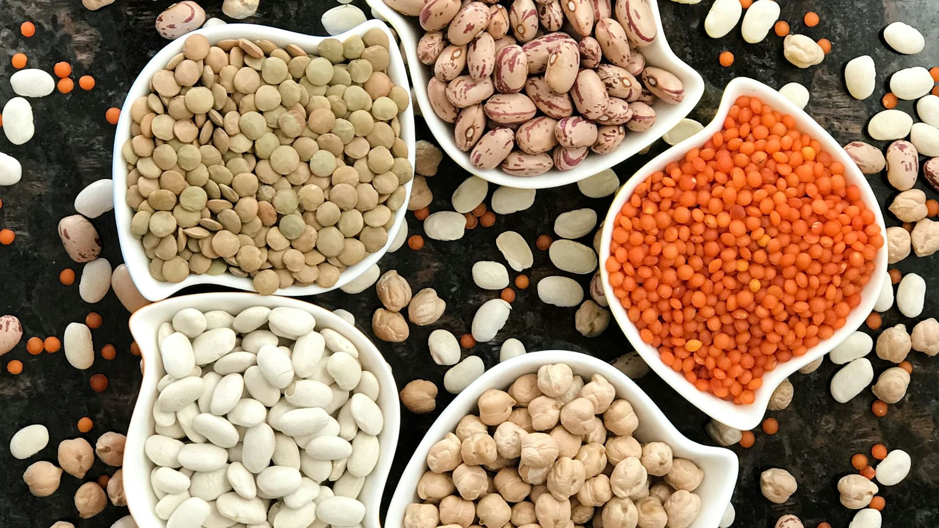 brown and white round food on black surface