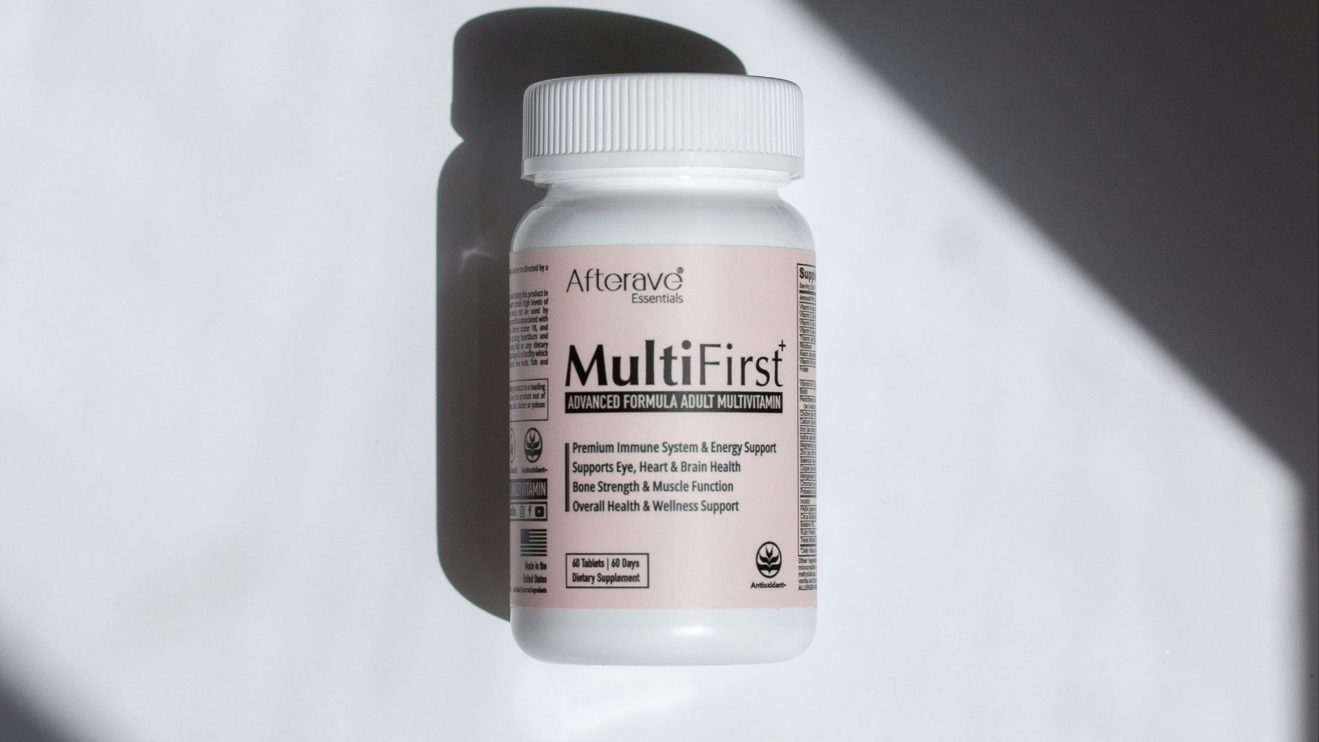 a close up of a bottle of pills on a table