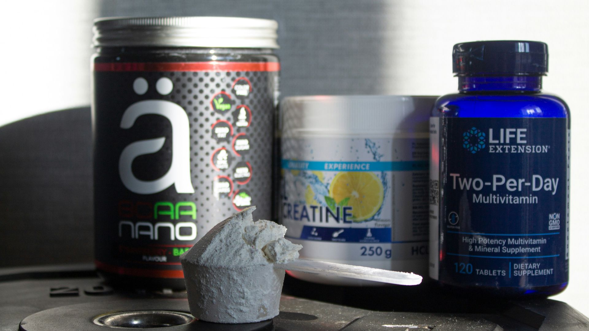 a table topped with bottles of vitamins and pills