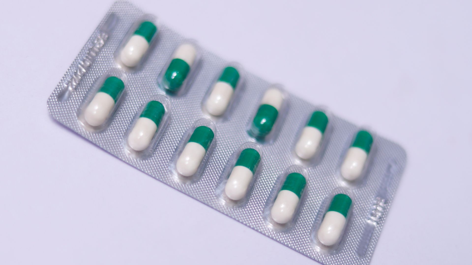 a pack of pills sitting on top of a white table