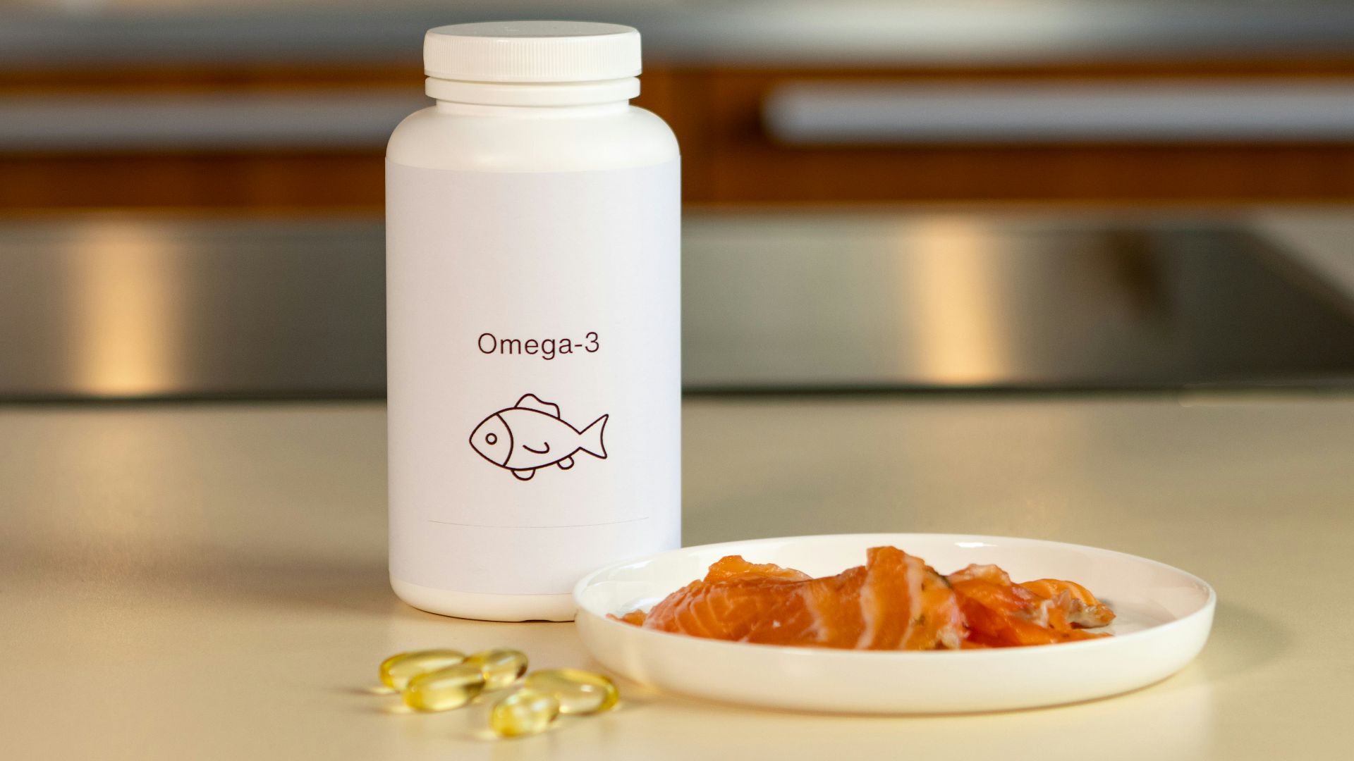 a bowl of fish next to a bottle of vitamins