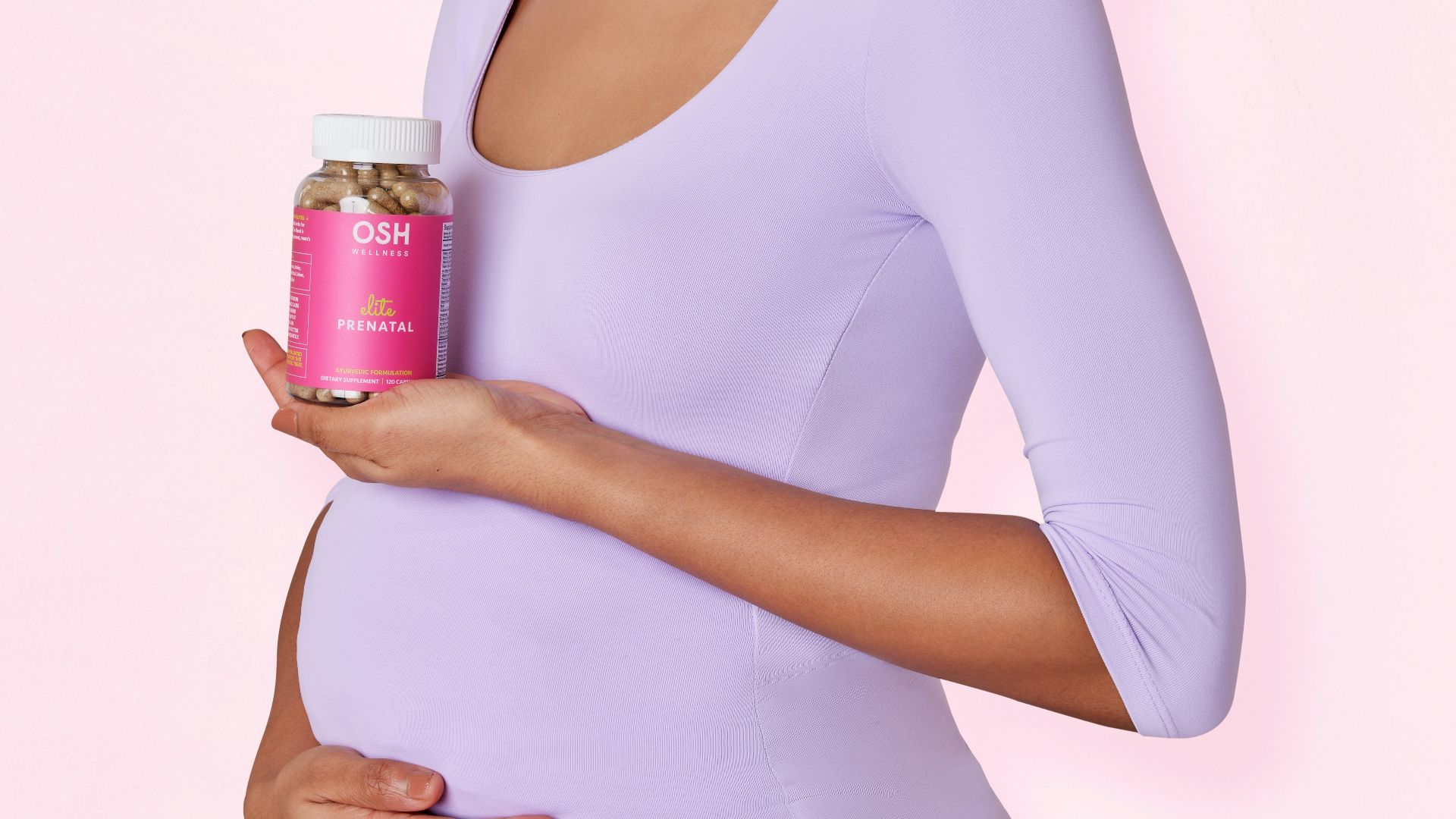 A pregnant woman holding a can of canned food