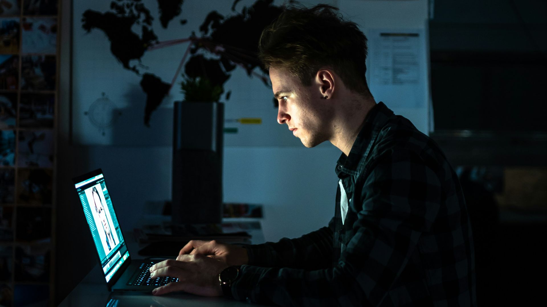 man sitting in front of a computer