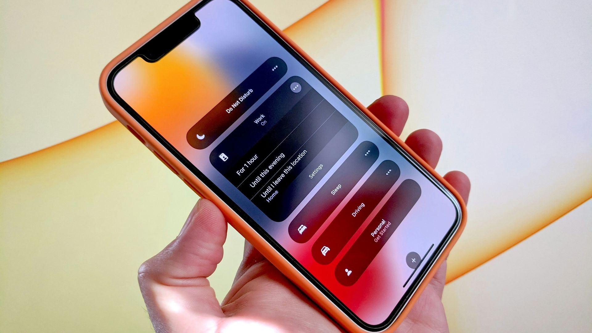 a person holding a cell phone in their hand