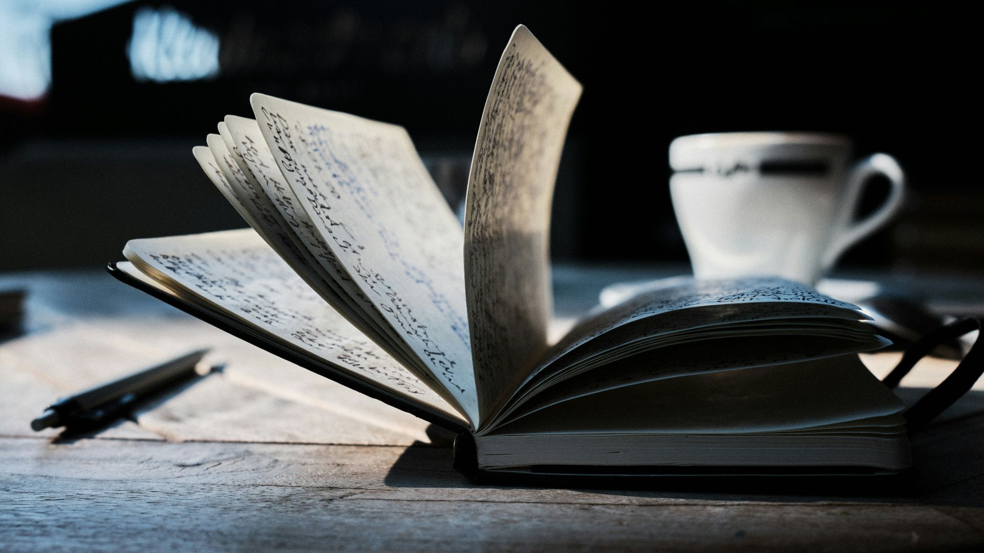 open book on brown wooden table