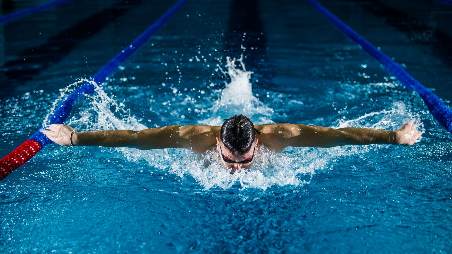 man doing butterfly stroke
