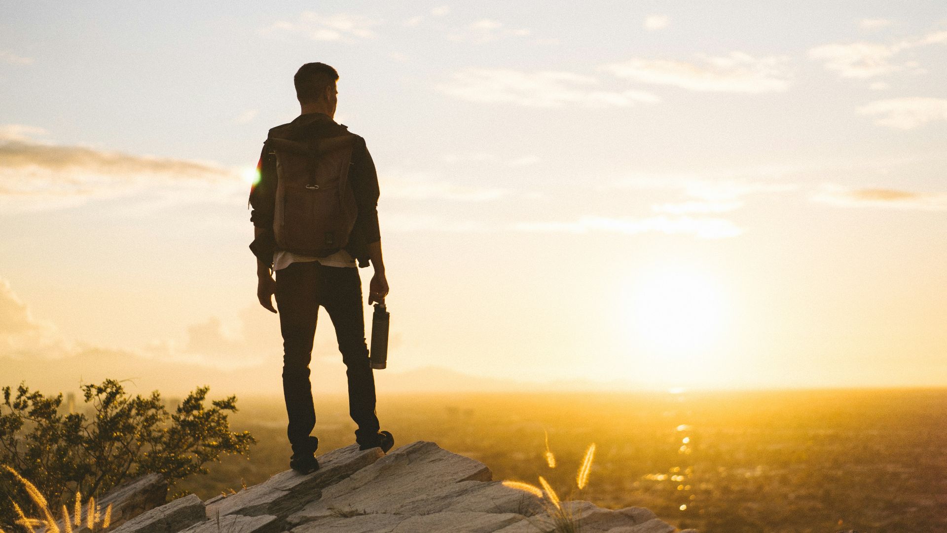 man standing on cliff