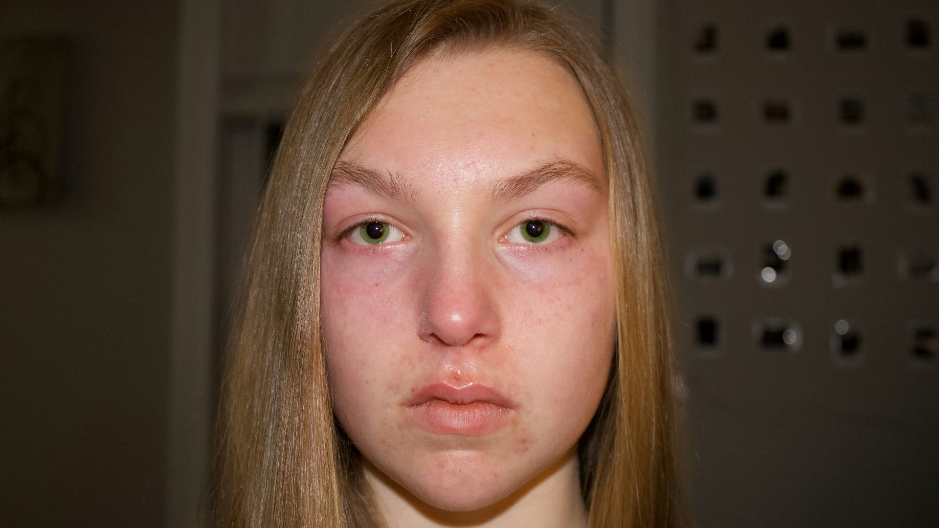 woman in white shirt taking selfie