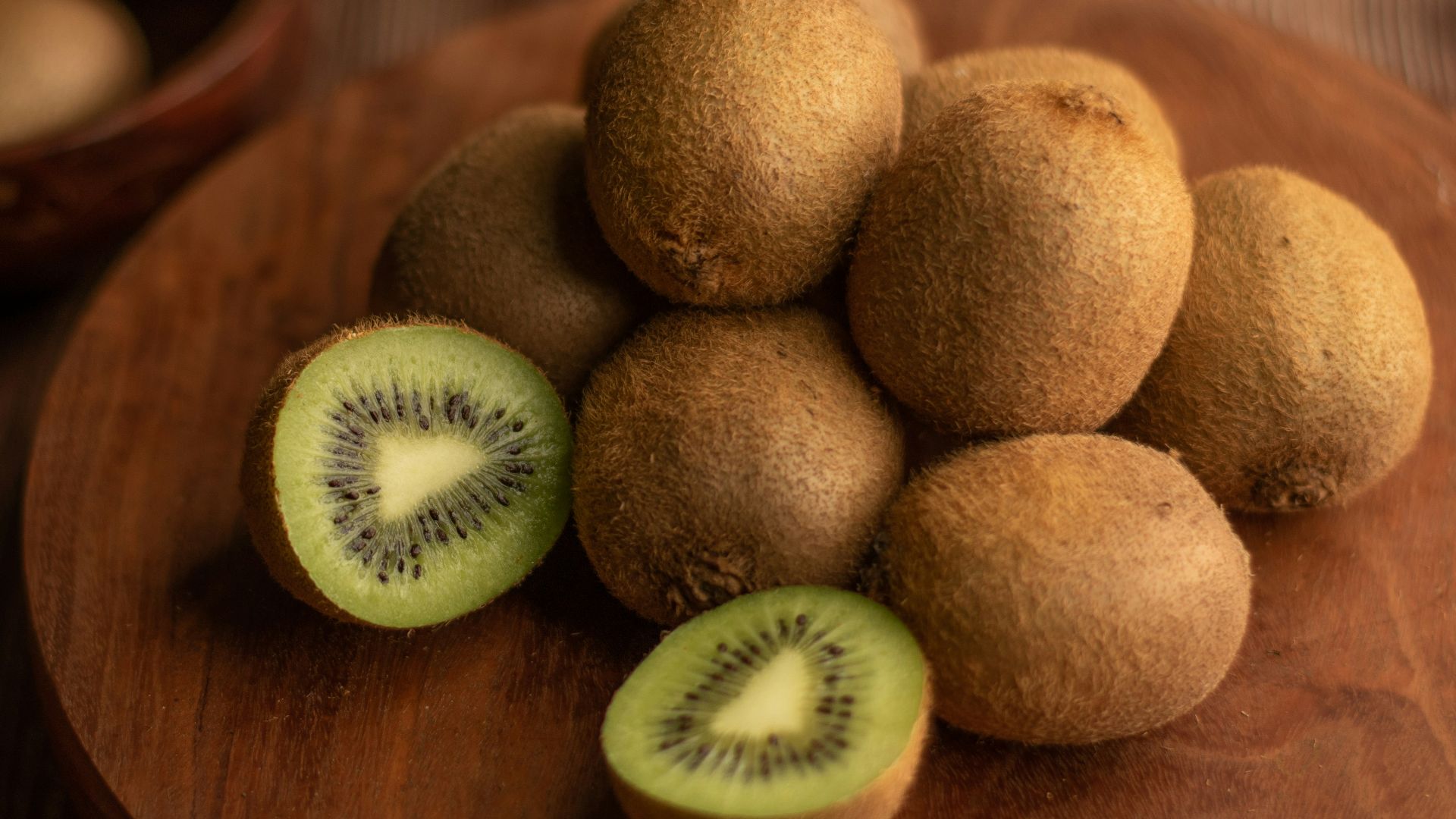 brown round fruit on brown wooden table