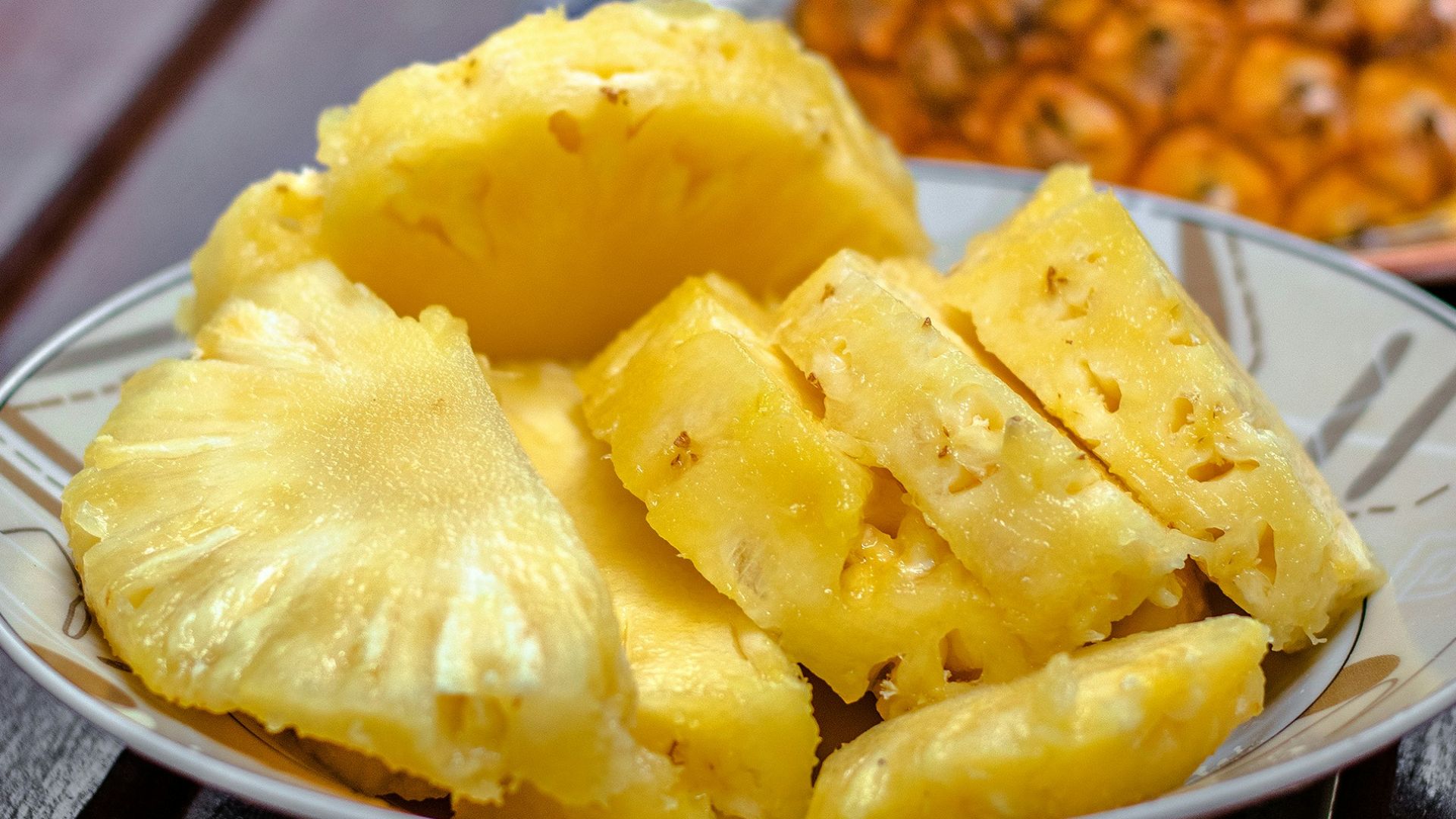 sliced pineapple on white ceramic plate