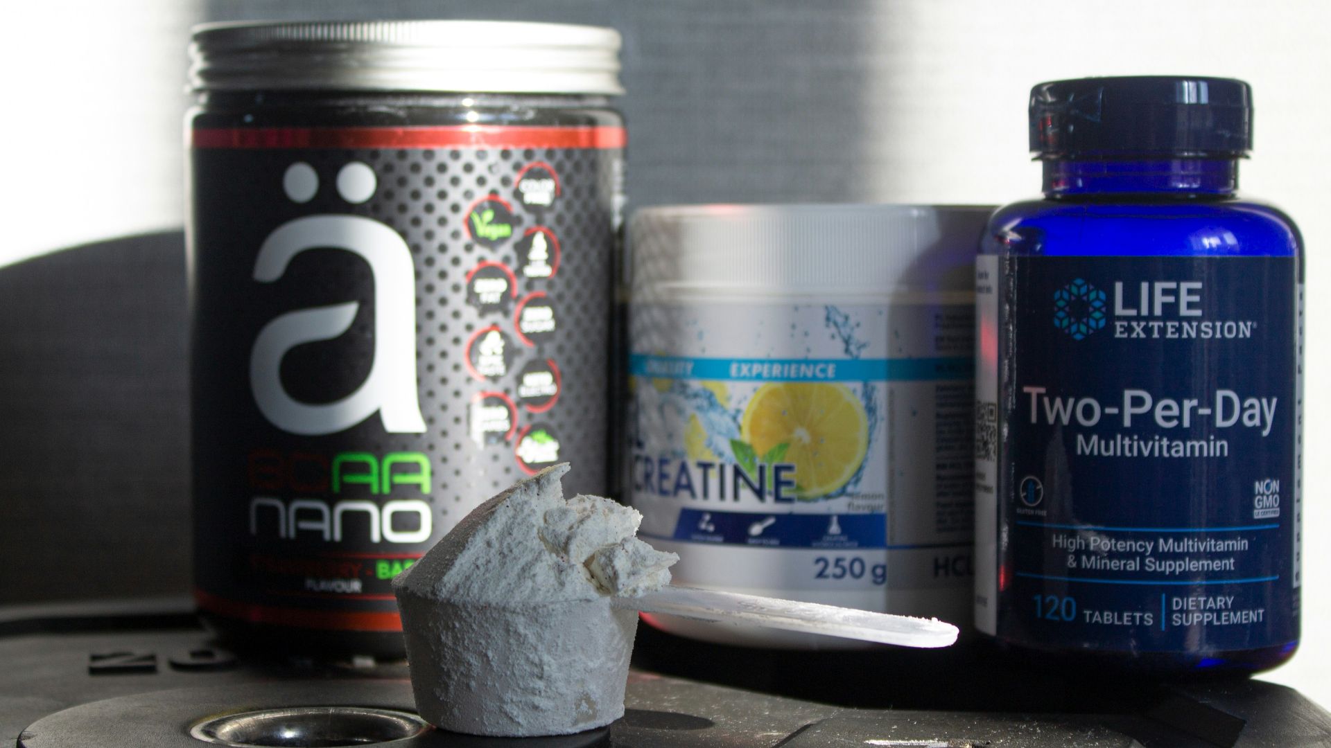 a table topped with bottles of vitamins and pills