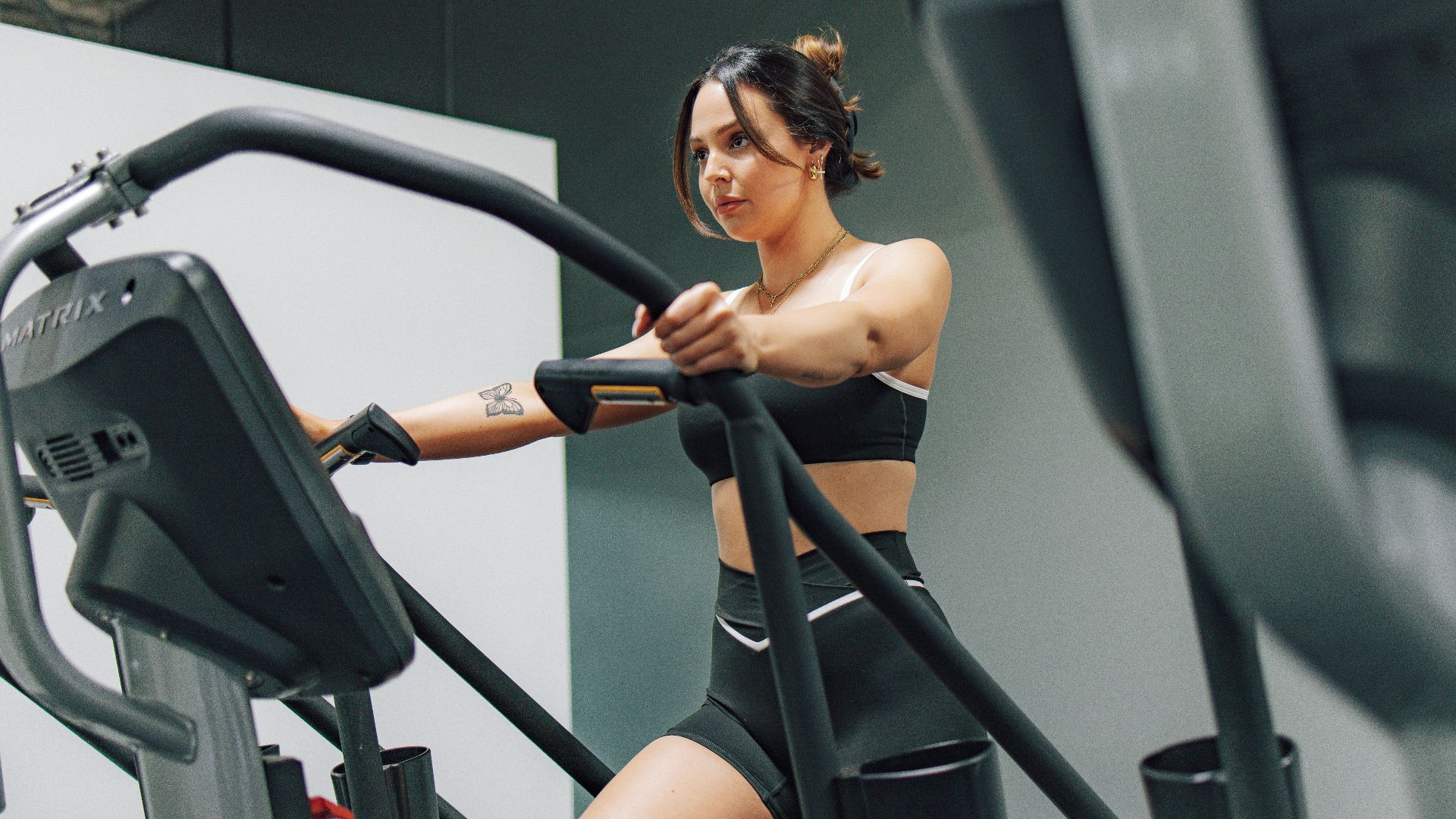 a woman on a treadmill in a gym