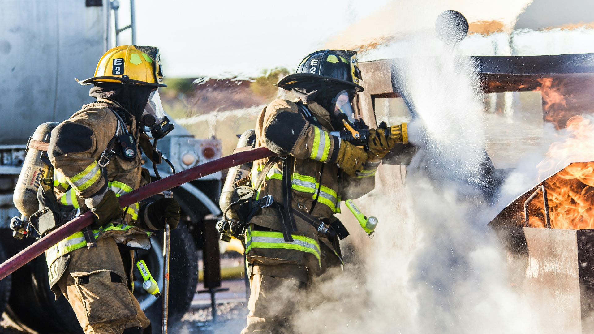three fireman preventing fire during daytime