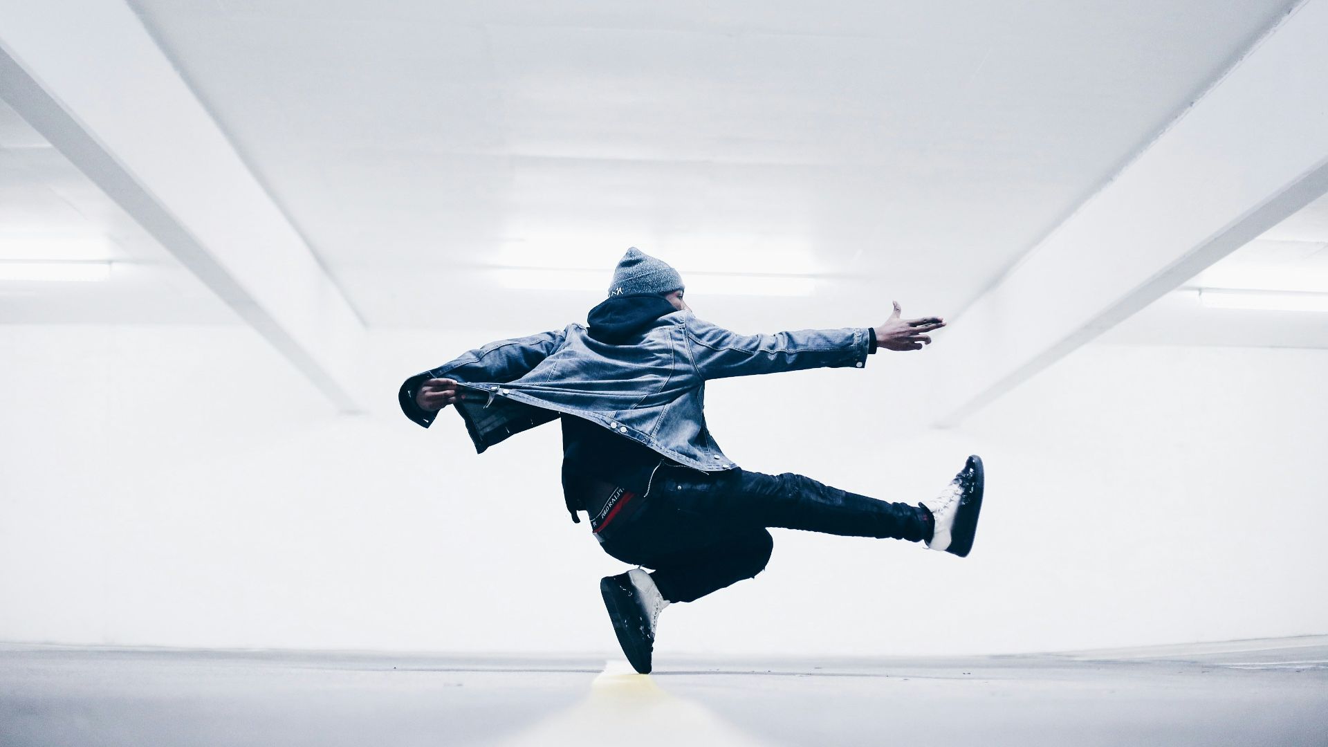 man jumping in the middle taken at daytime