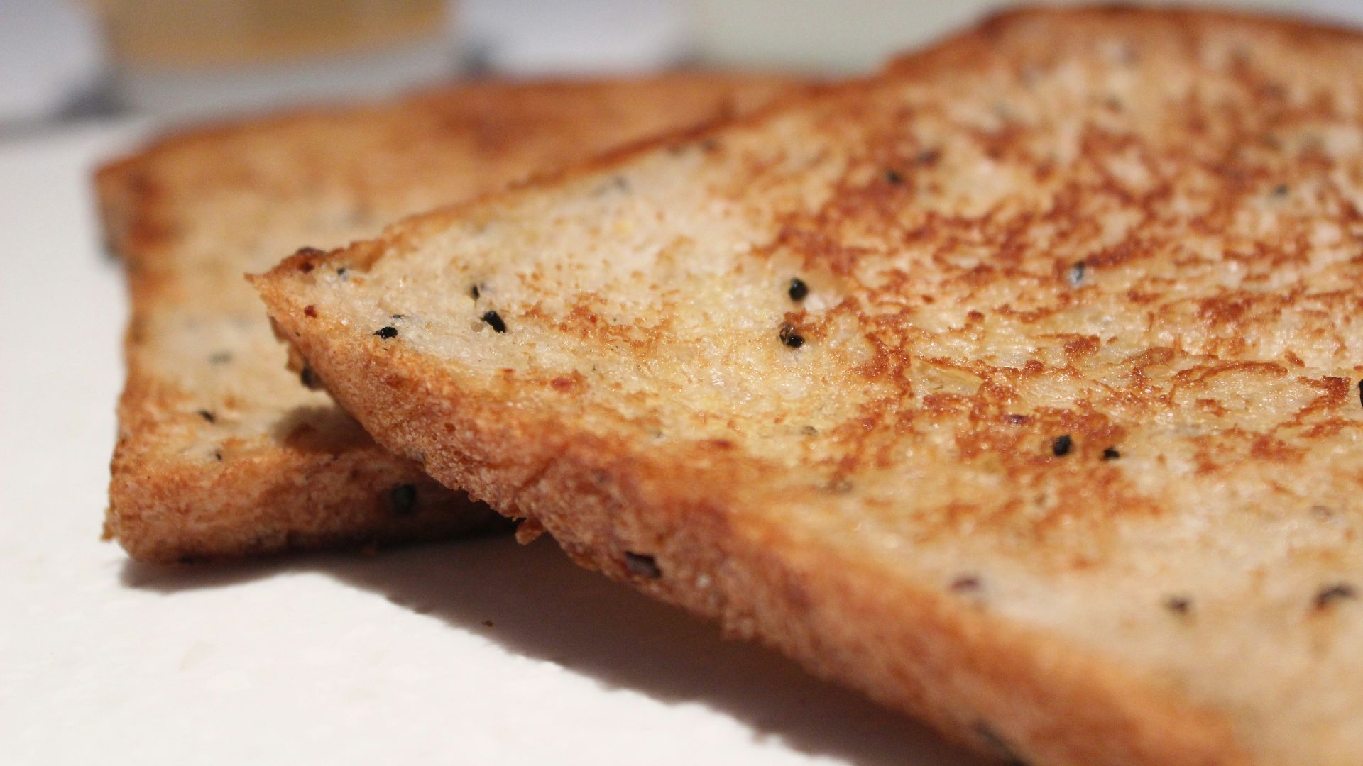 a close up of a grilled cheese sandwich on a plate