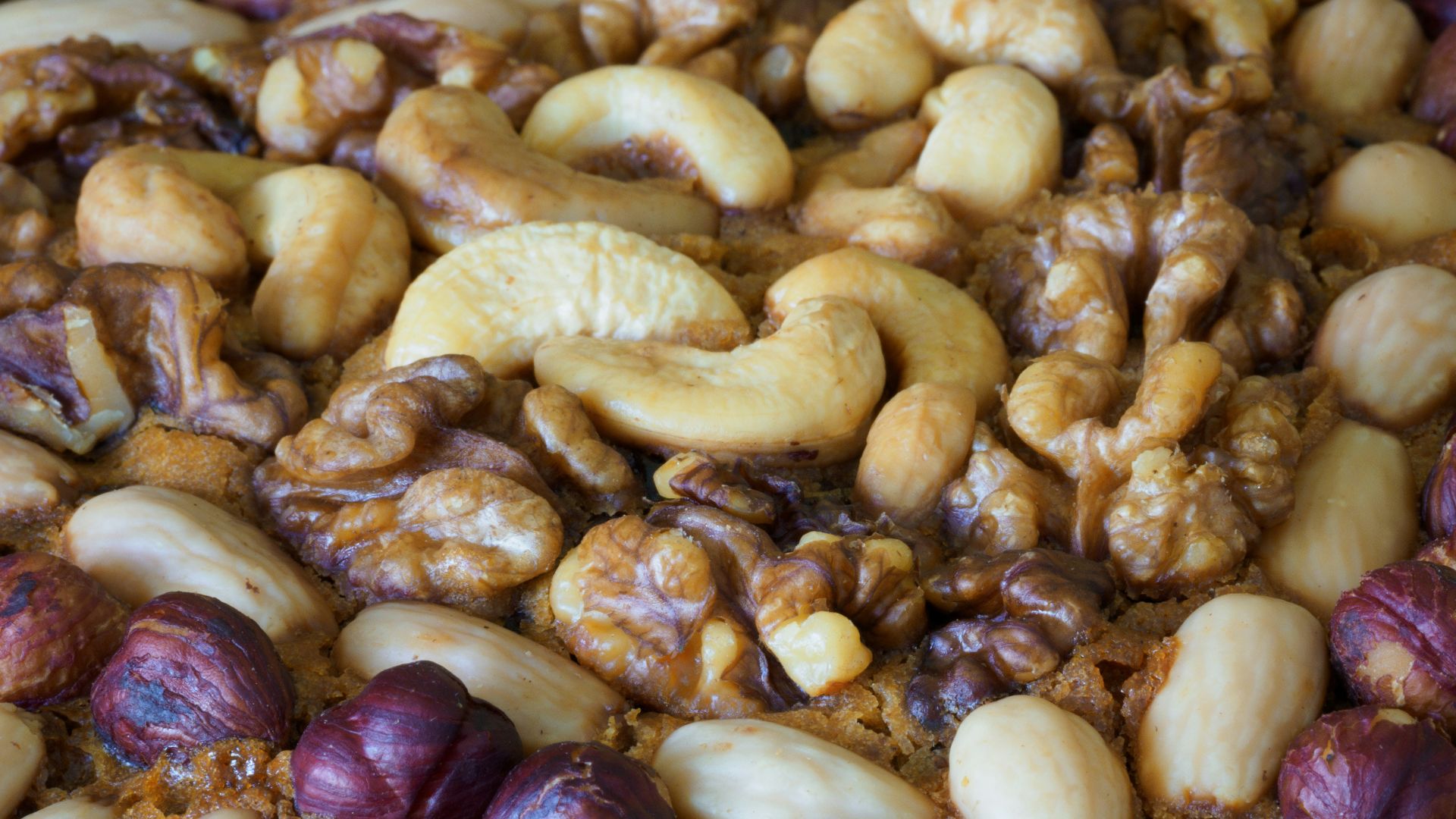 brown and beige nuts on white paper