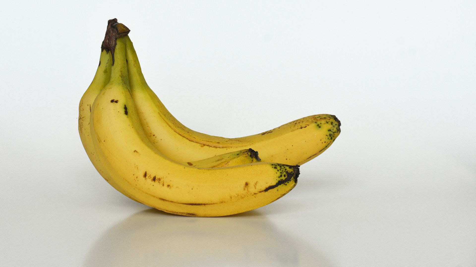 yellow banana on white table