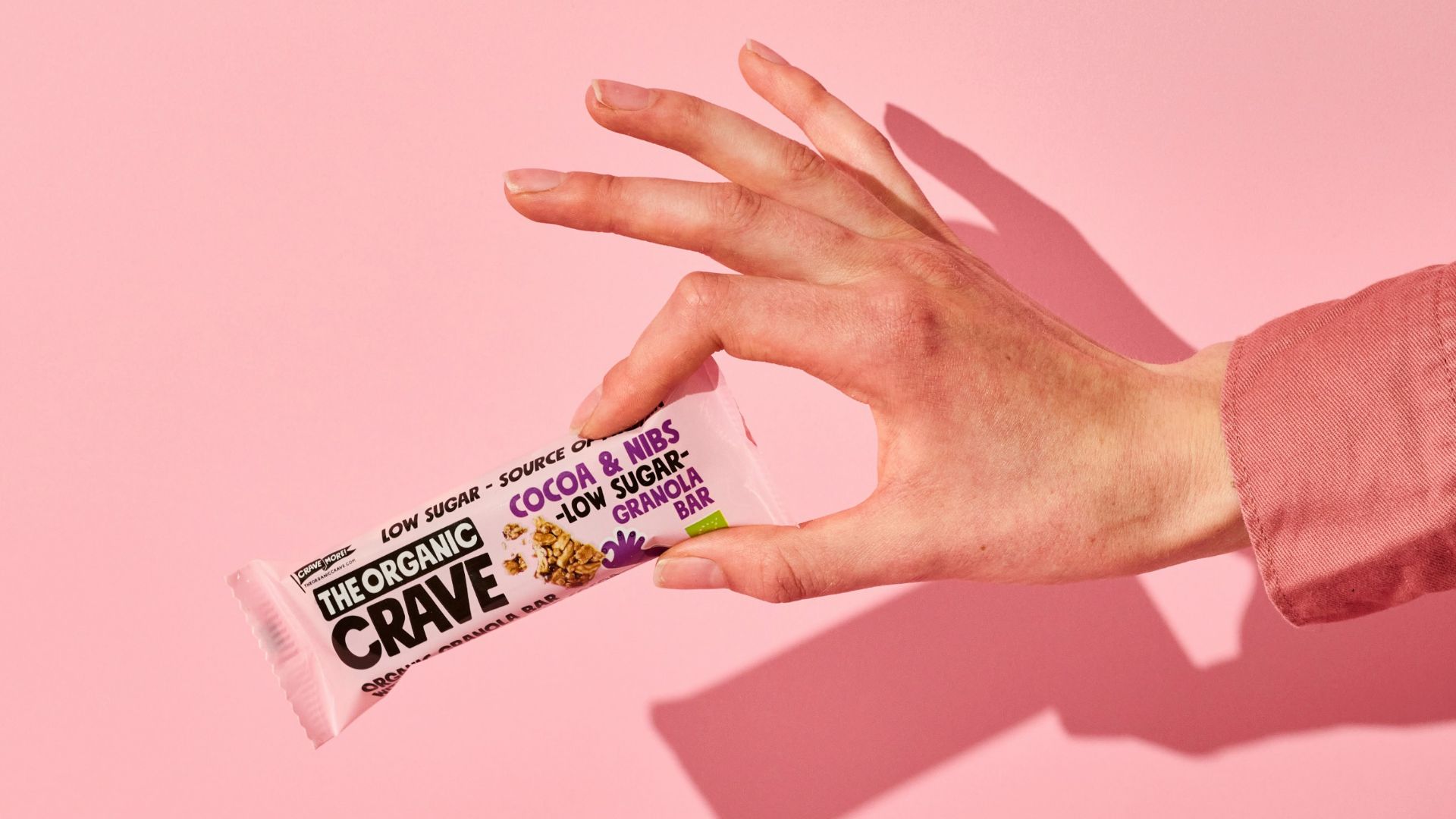 person holding white and blue tube bottle