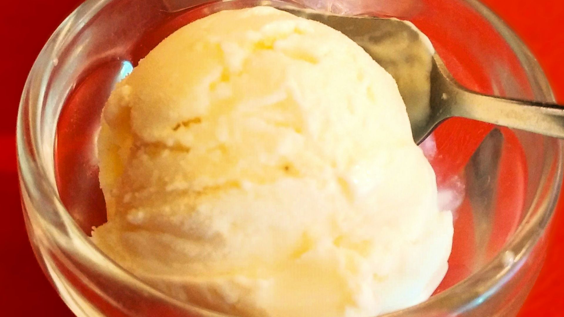 two bowls of ice cream on a red table