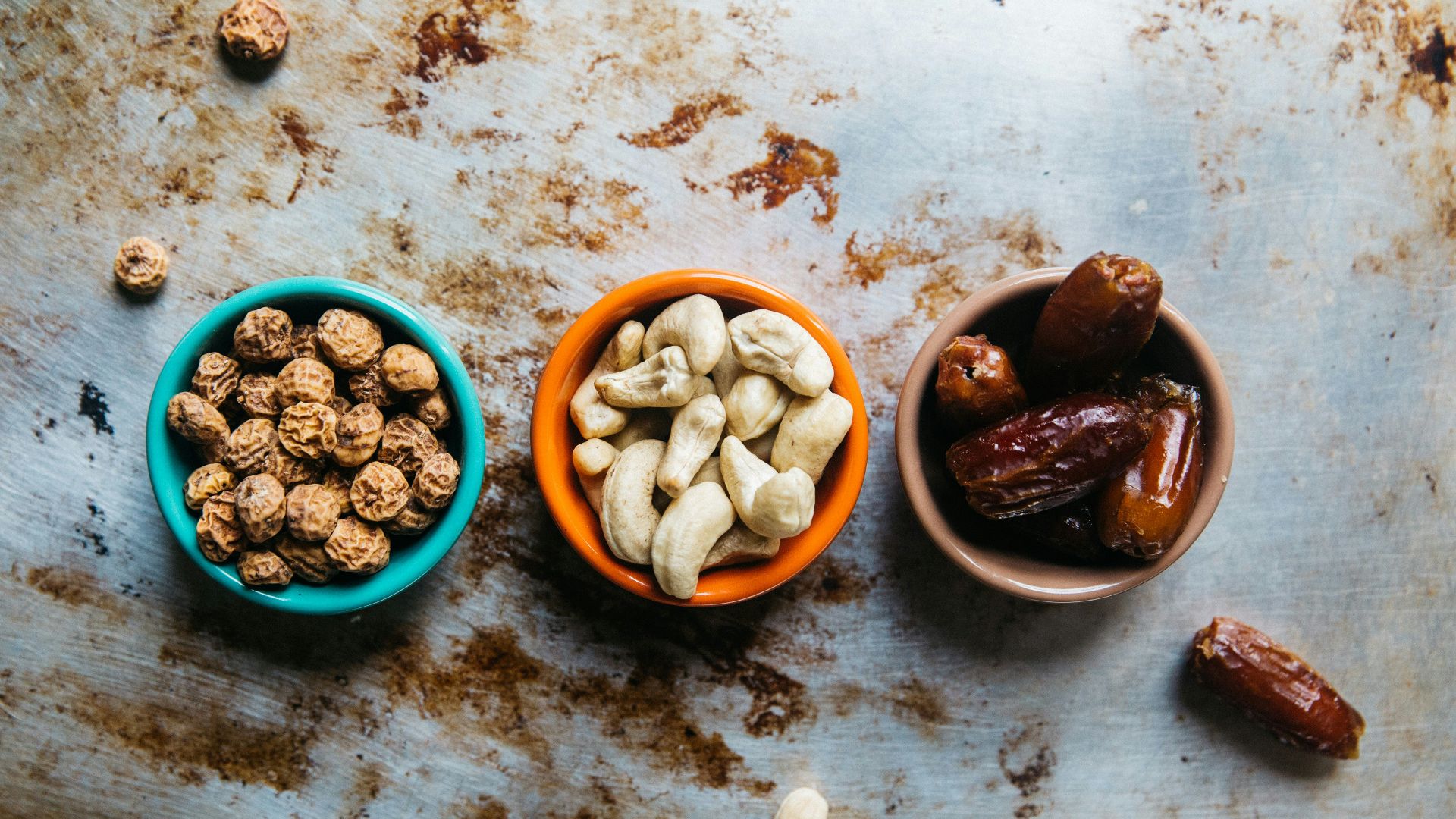 three bowls of nuts