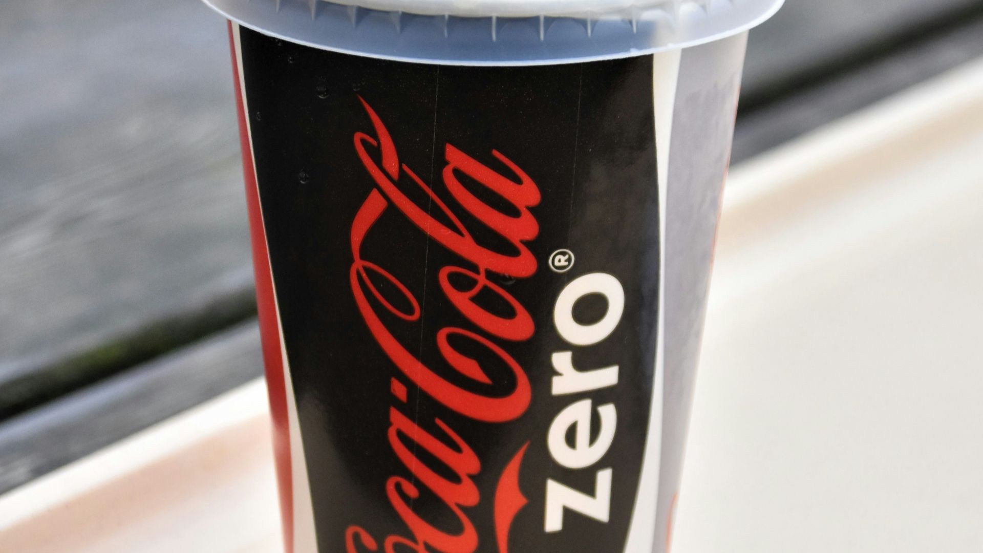 coca cola disposable cup with straw