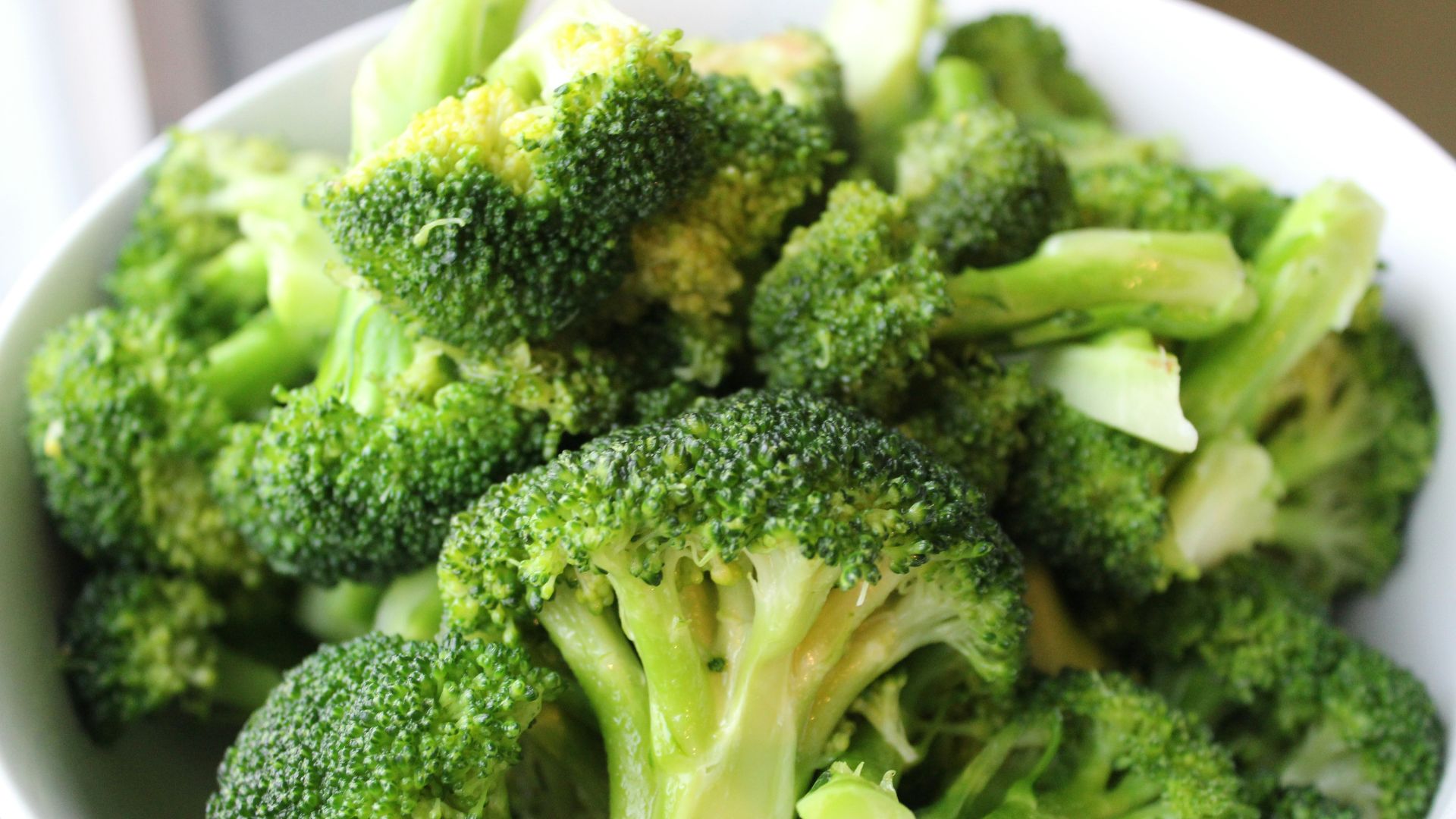 green broccoli on white ceramic plate